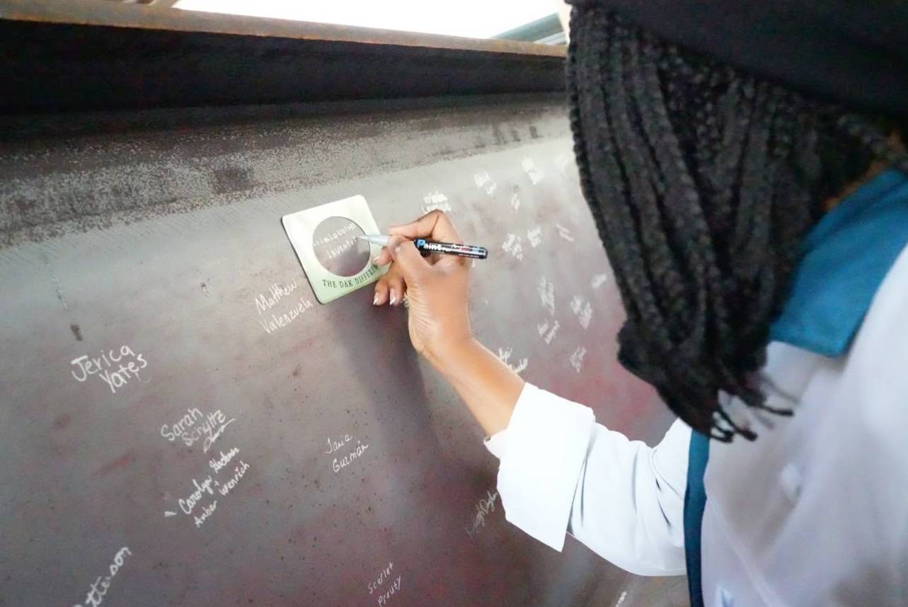 Disney's Animal Kingdom Cast Signing Steel Beam for Encanto Show Building