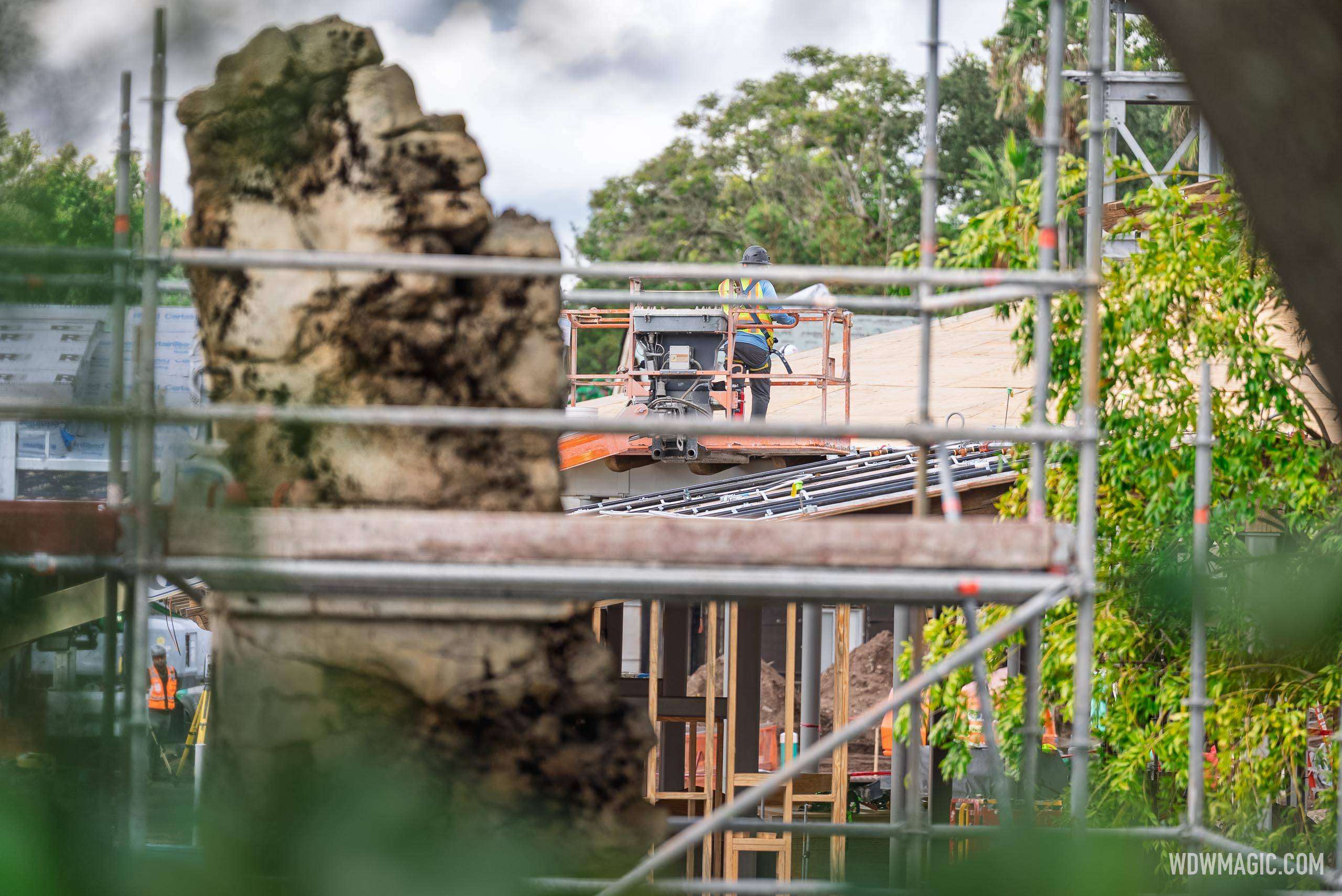 Crews working on the roof of the carousel queue