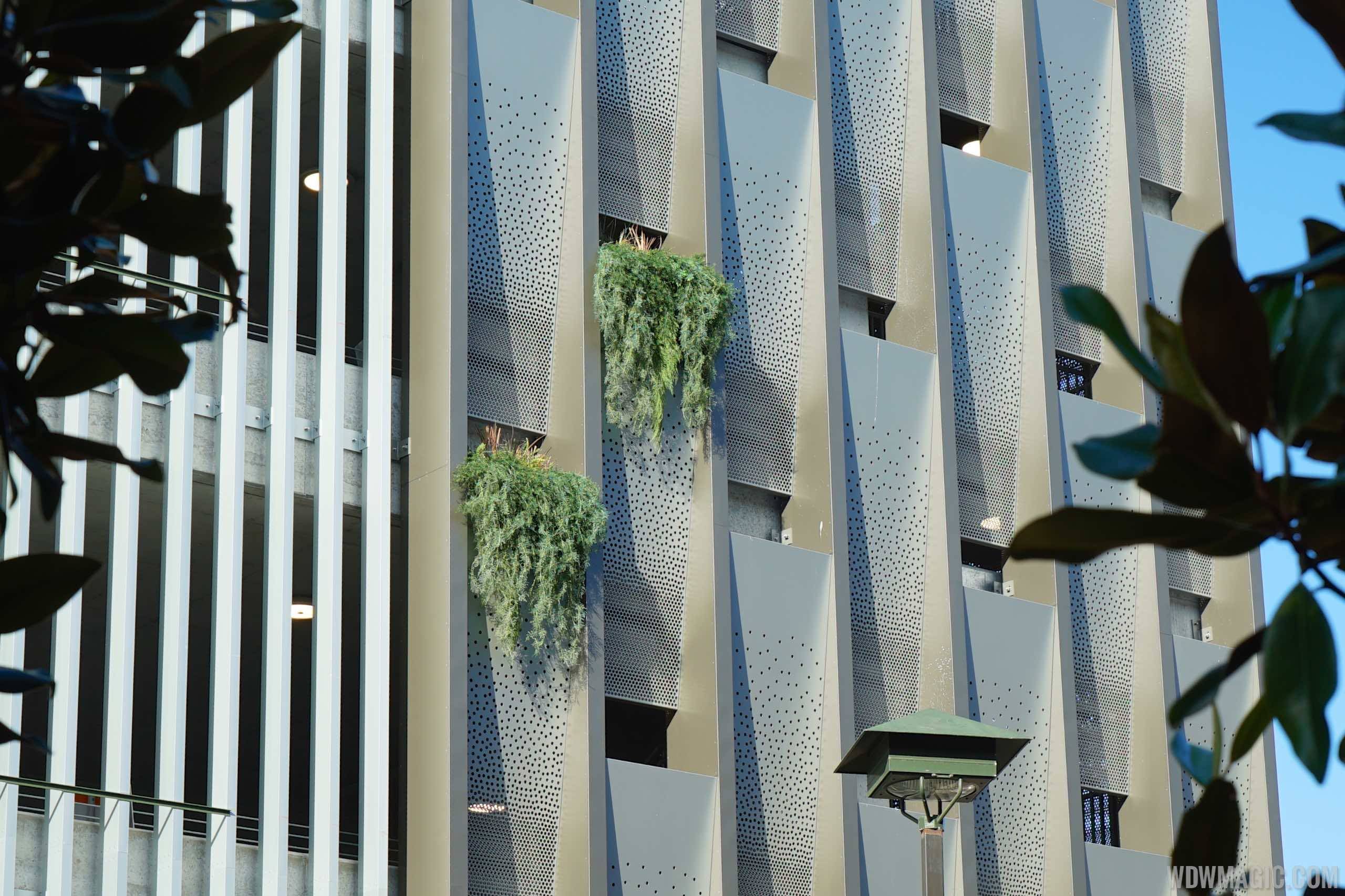 PHOTOS - First plants installed on the outside of the Disney Springs West Side Orange Parking Garage