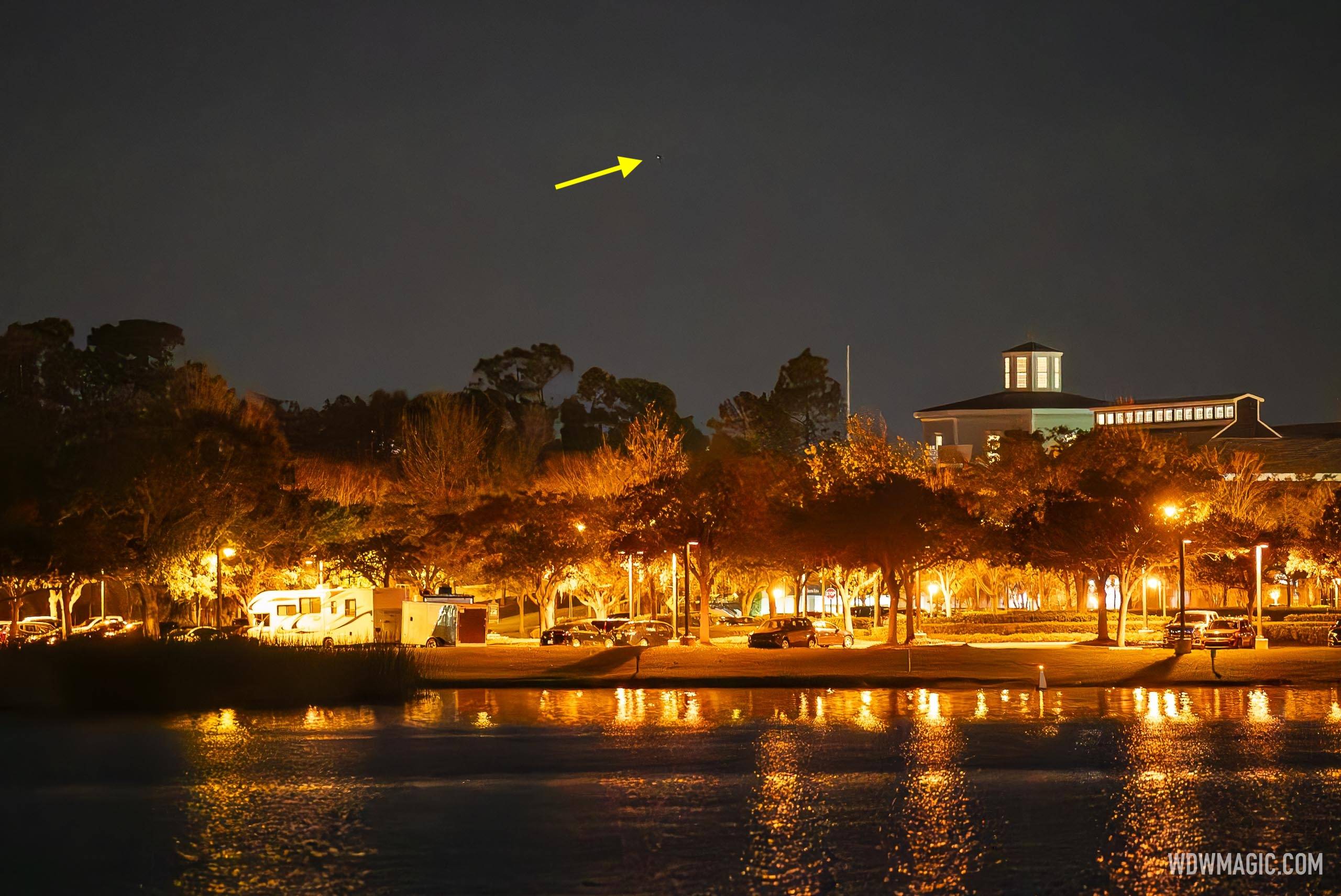 The drone in flight over the Disney Springs lake