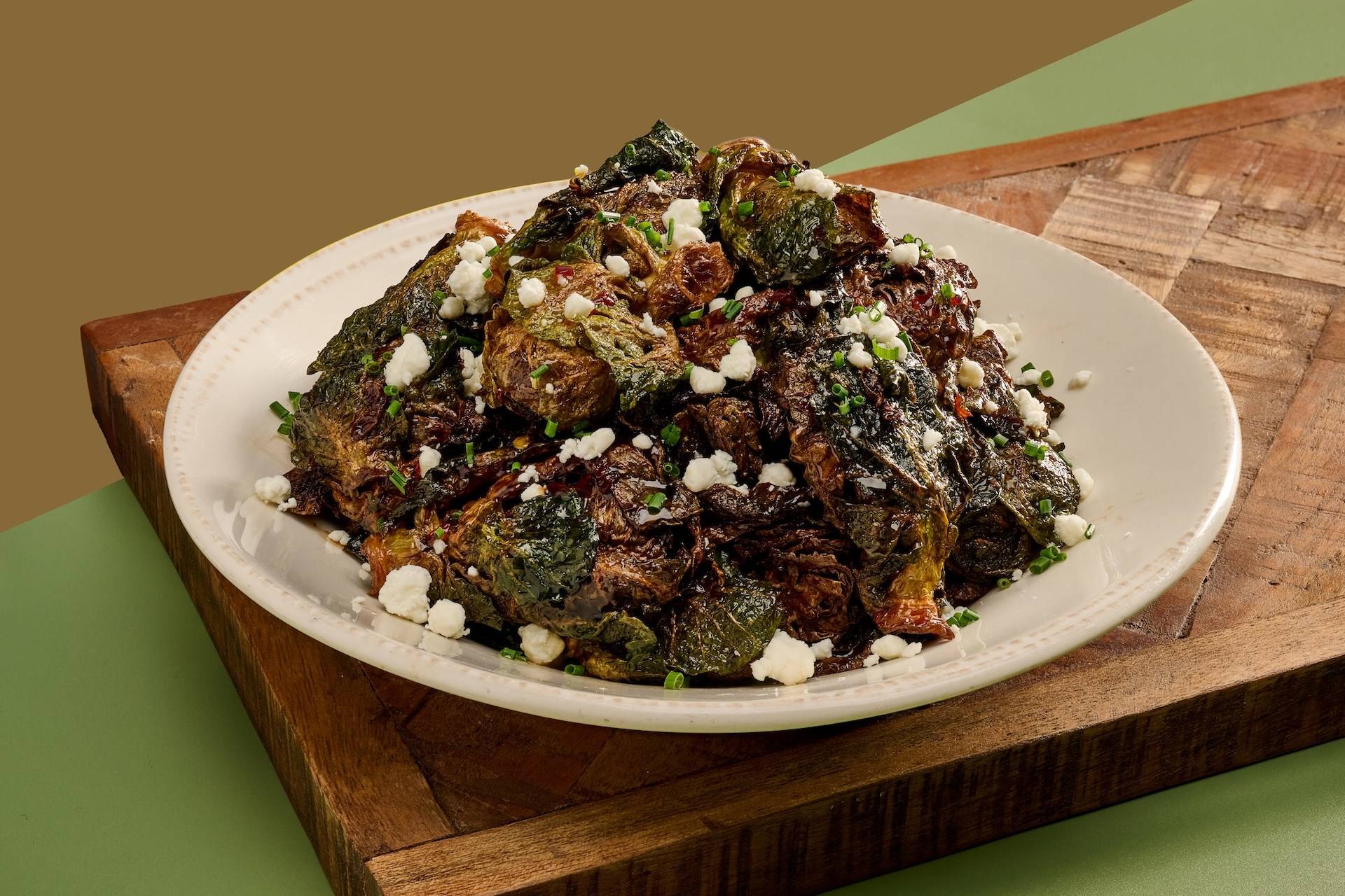Fried Brussels Sprouts Tossed in Balsamic Glaze Drizzled with Spicy Honey and To