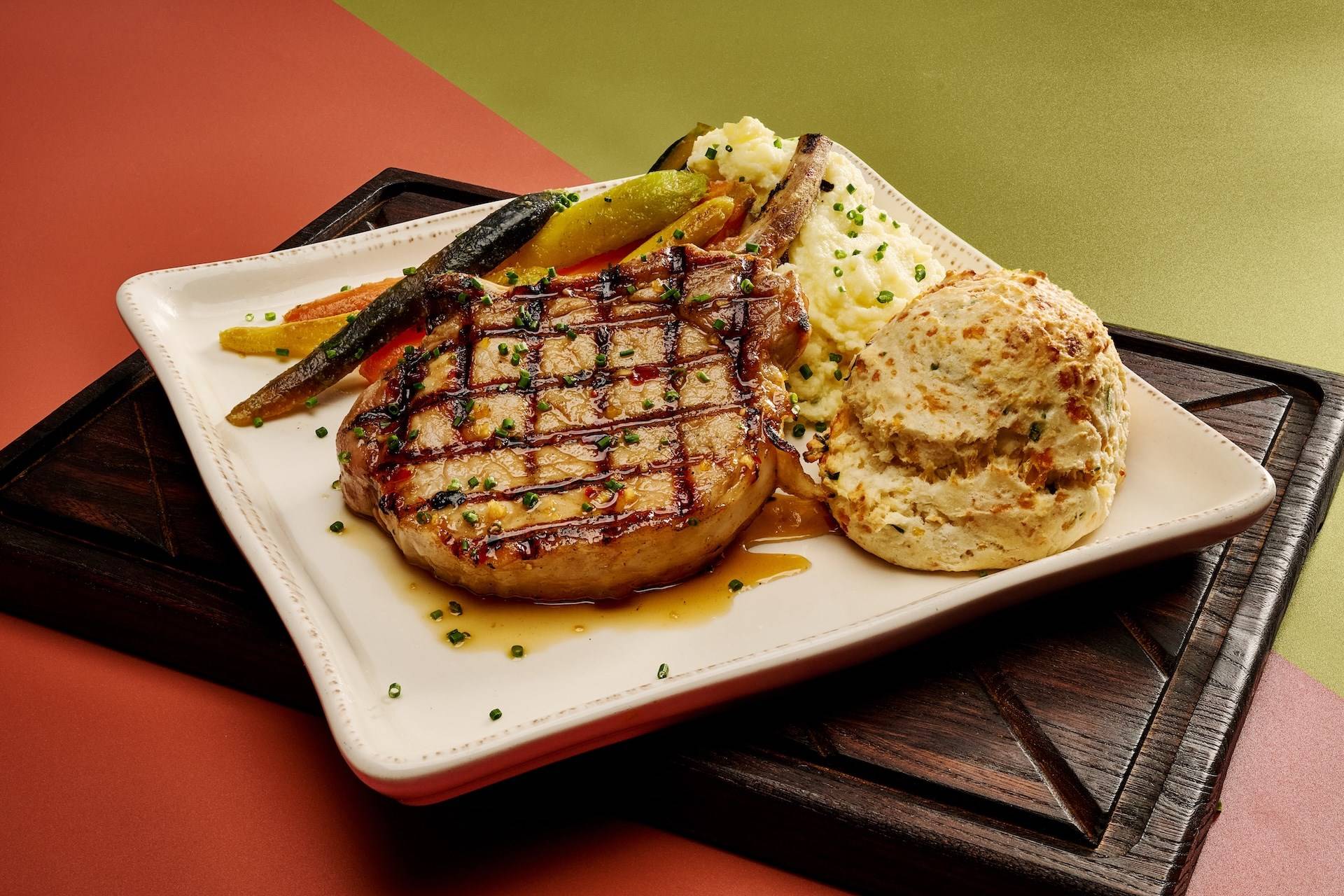 Tuscan Pork Chop Lemon and Herb Marinated Pork Chop Served Over a White Bean Rag