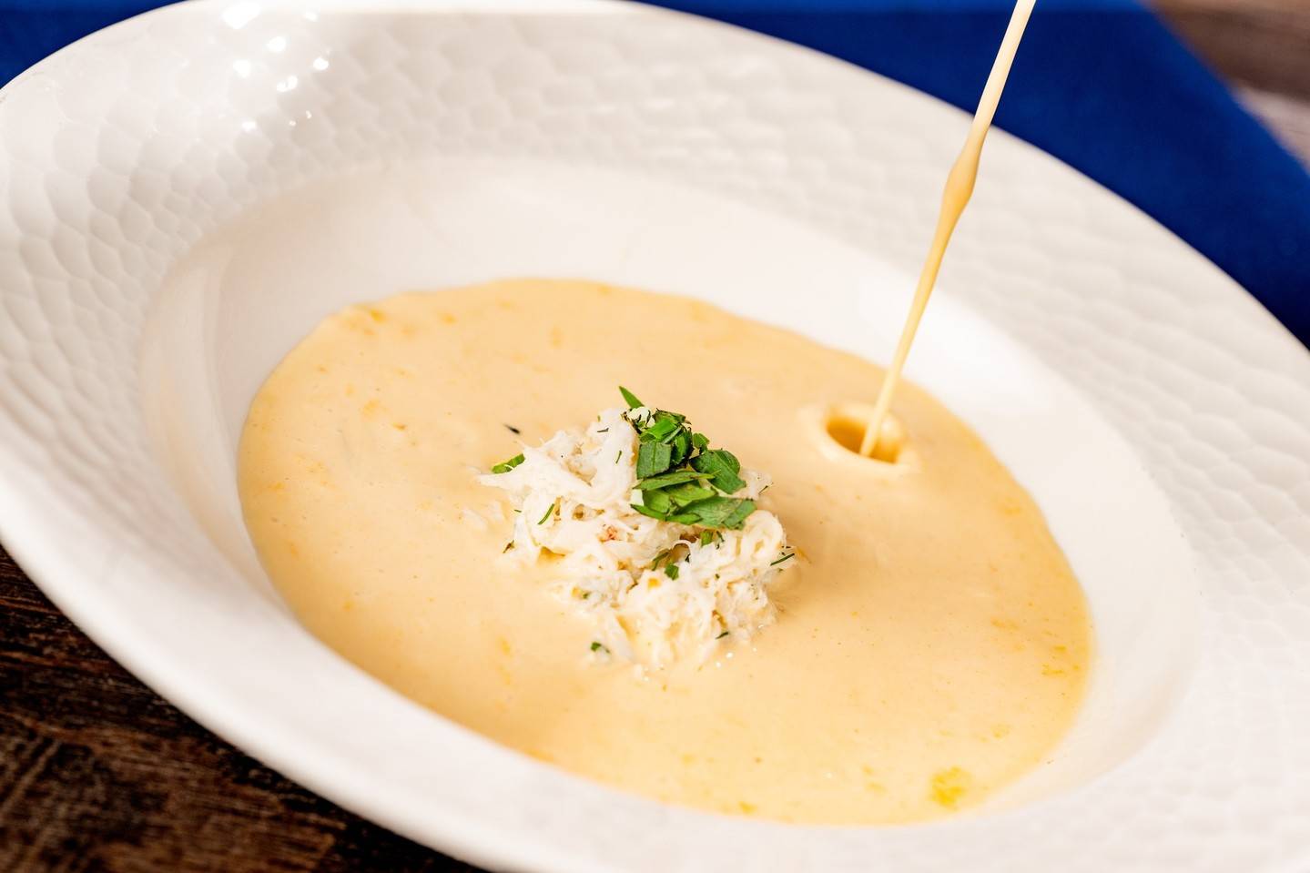 Blue Crab Bisque: Chili oil, sherry reduction, jumbo lump crab (available lunch and dinner)