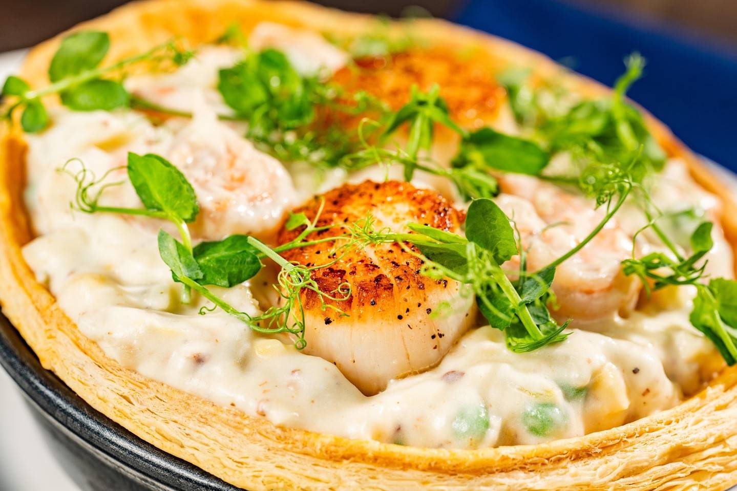 New England Seafood Pot Pie: Shrimp, scallops, jumbo lump crab, fish, baby vegetables, brandy-cream sauce, flaky crust (available dinner)