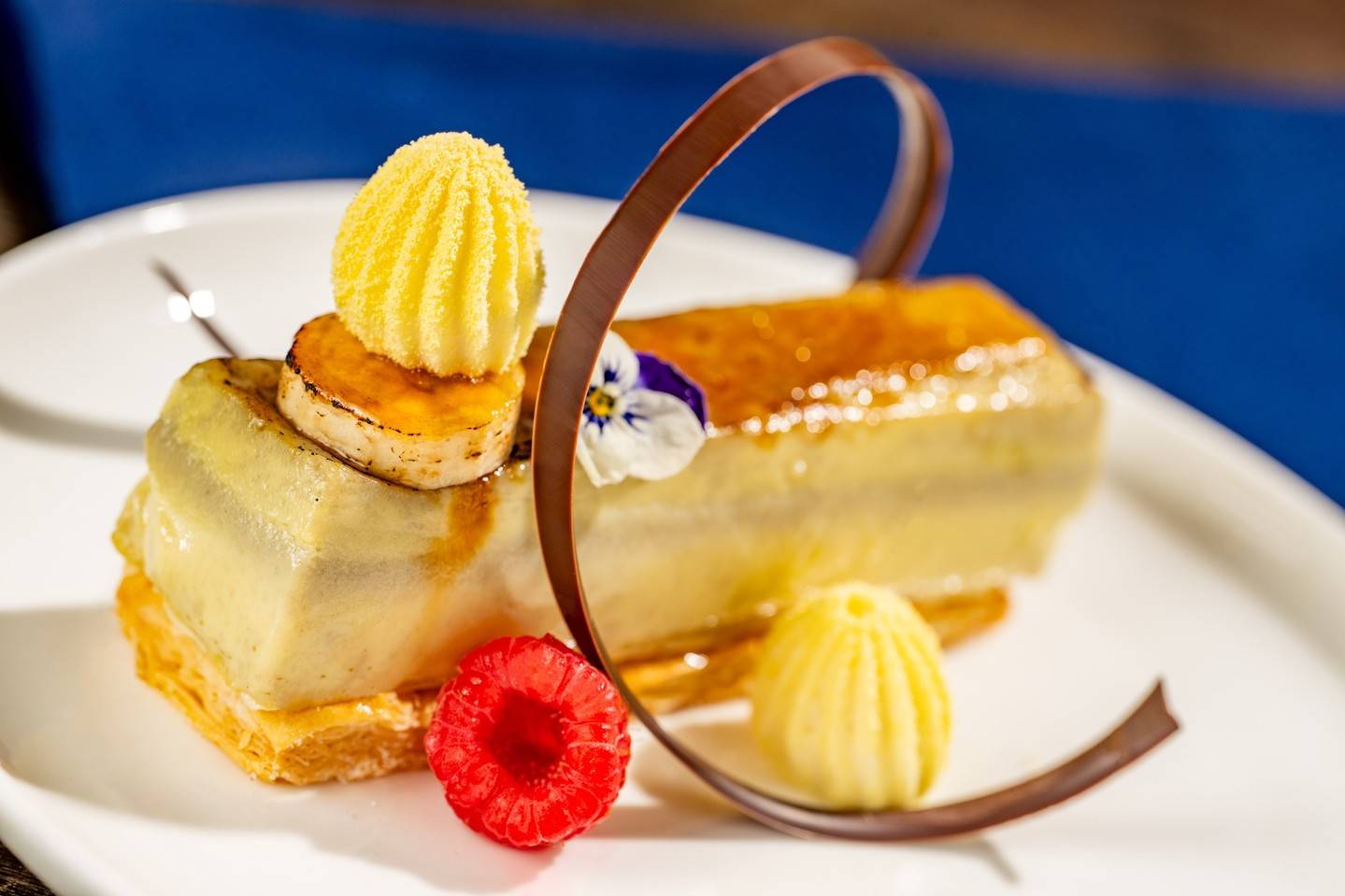 Boston Cream Pie: Vanilla chiffon, vanilla bean mousse, chocolate gla&ccedil;age, raspberry sauce