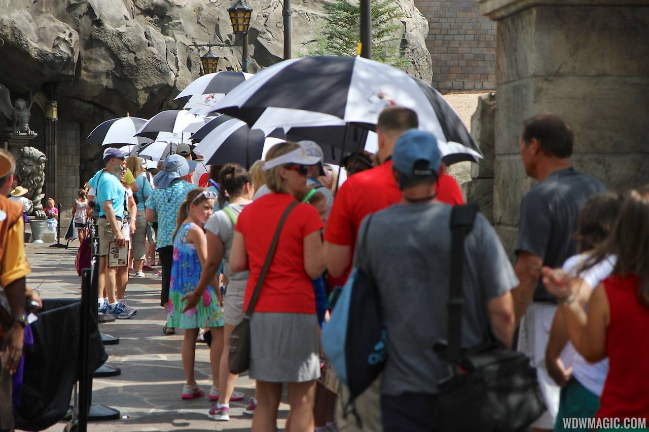 Be Our Guest Restaurant summer queue umbrellas