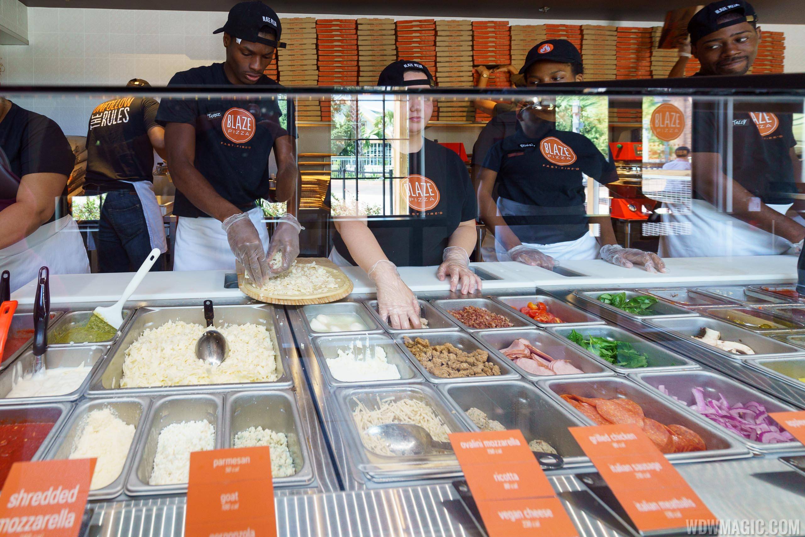 Building the pizza at Blaze Pizza