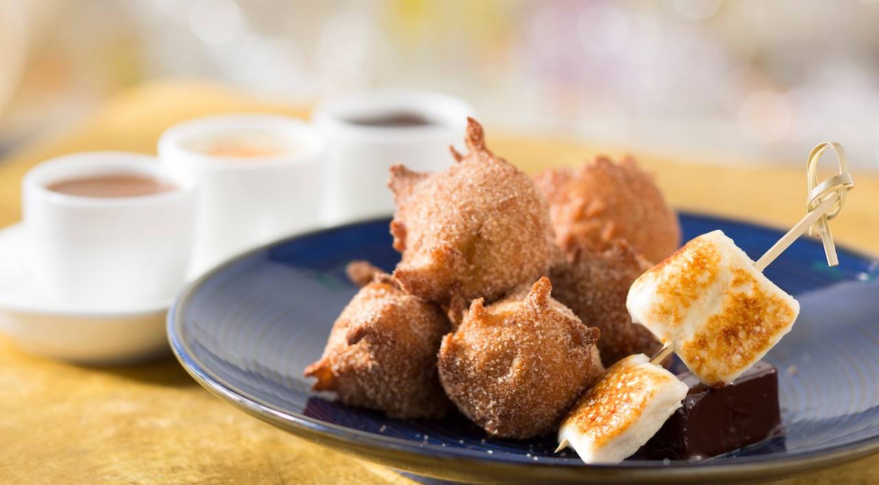 New California Grill menu - Warm homemade banana fritters dusted with sugar and cinnamon and served with toasted caramel marshmallow and a trio of dipping sauces – peanut butter, salted caramel and chocolate