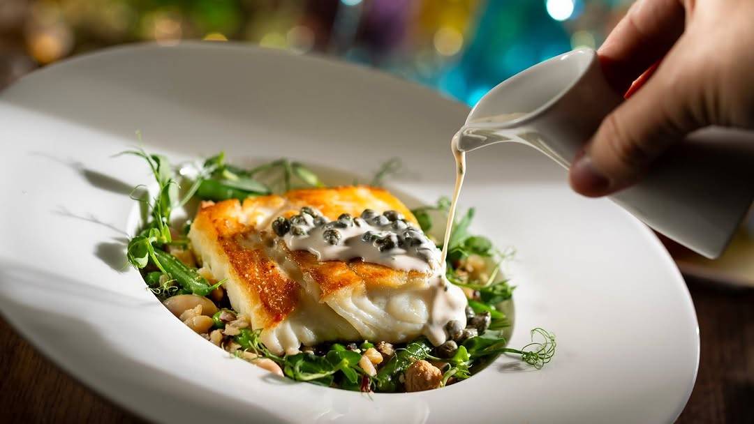 Seared Market Fish: Wax beans, ancient grains, English peas, Marcona almonds, and Meyer lemon-caper butter sauce