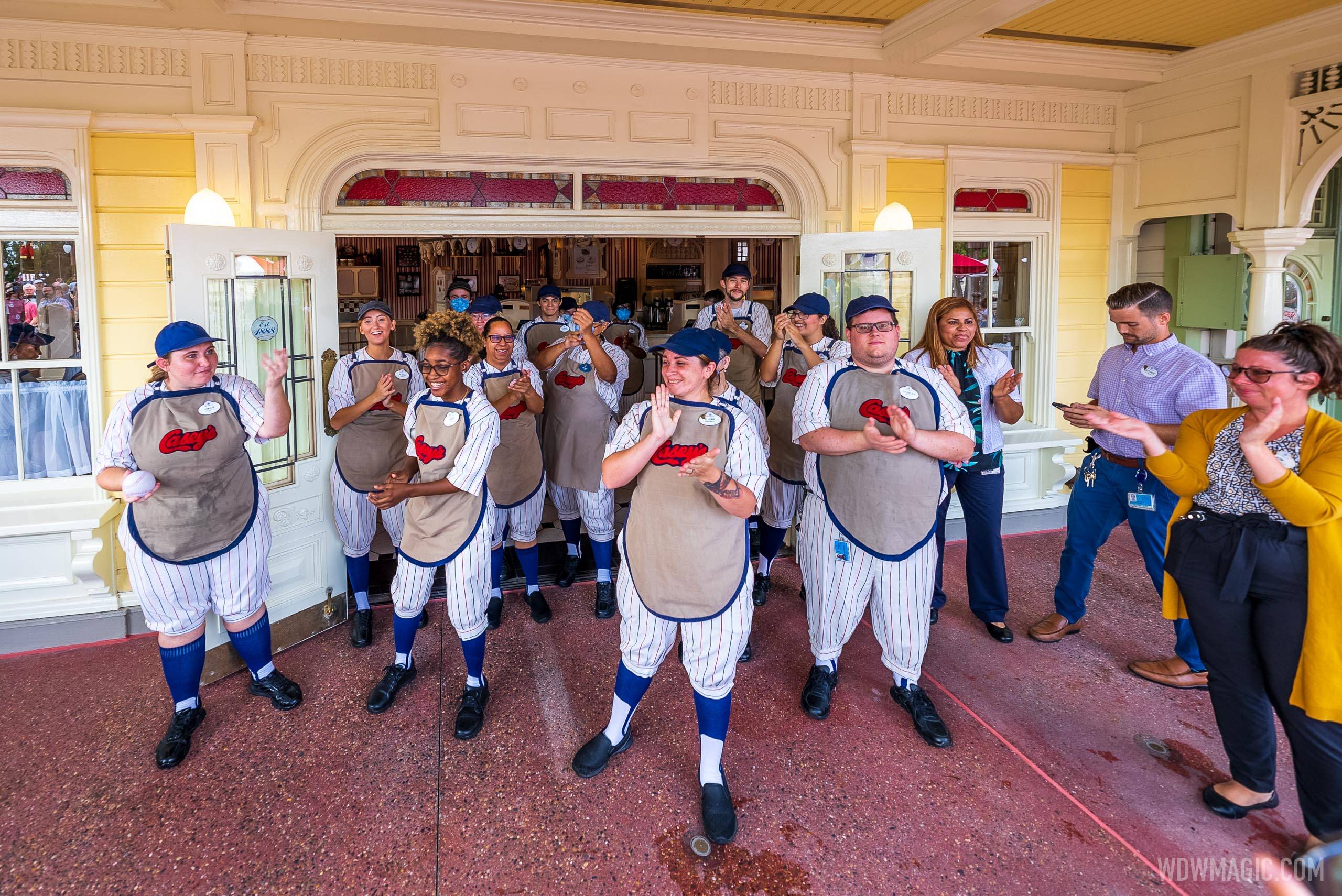 Cast Members welcome guests back to Casey's Corner at Magic Kingdom