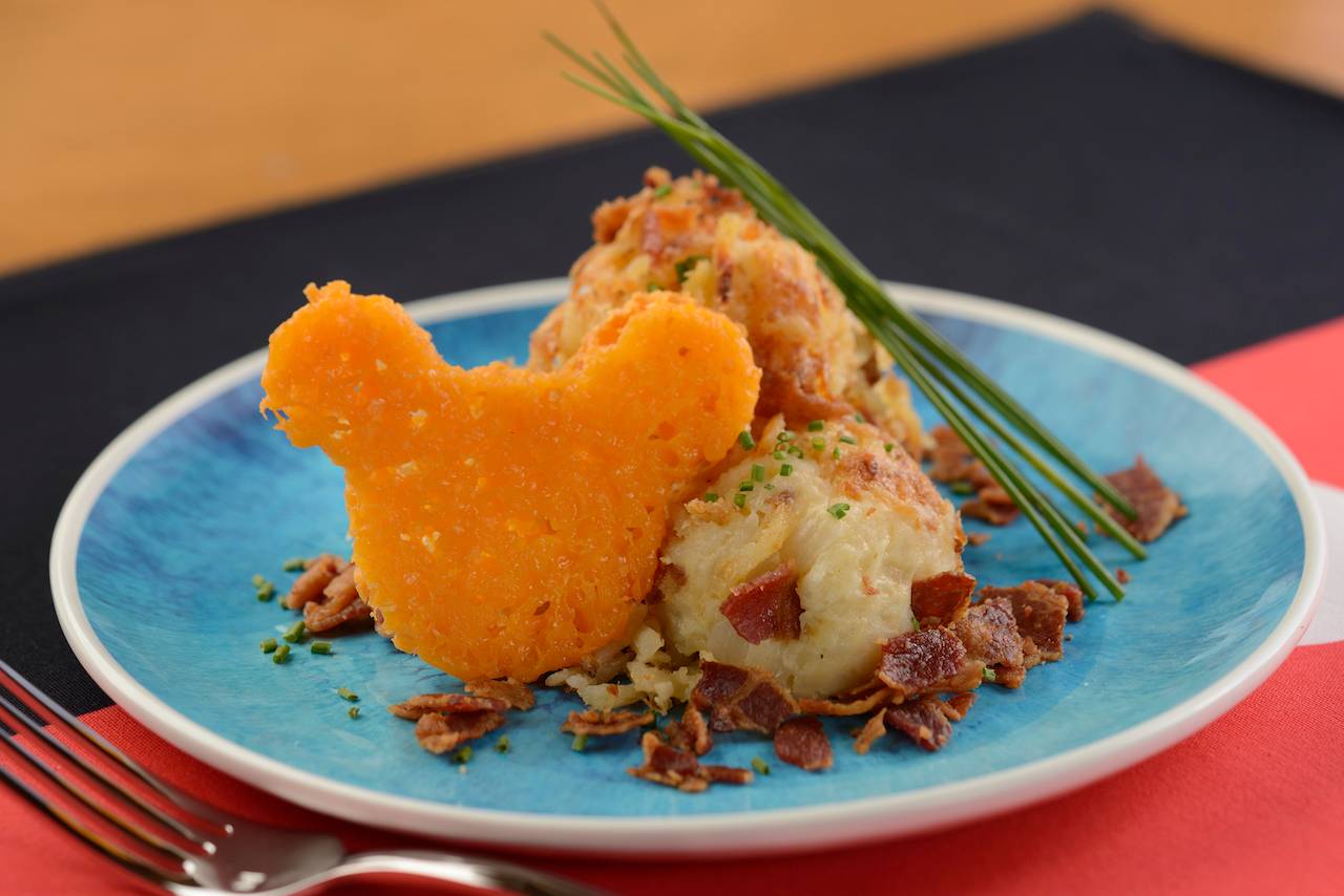 “Loaded” Potato-Cheese Casserole topped with smoked bacon crumbles and chives