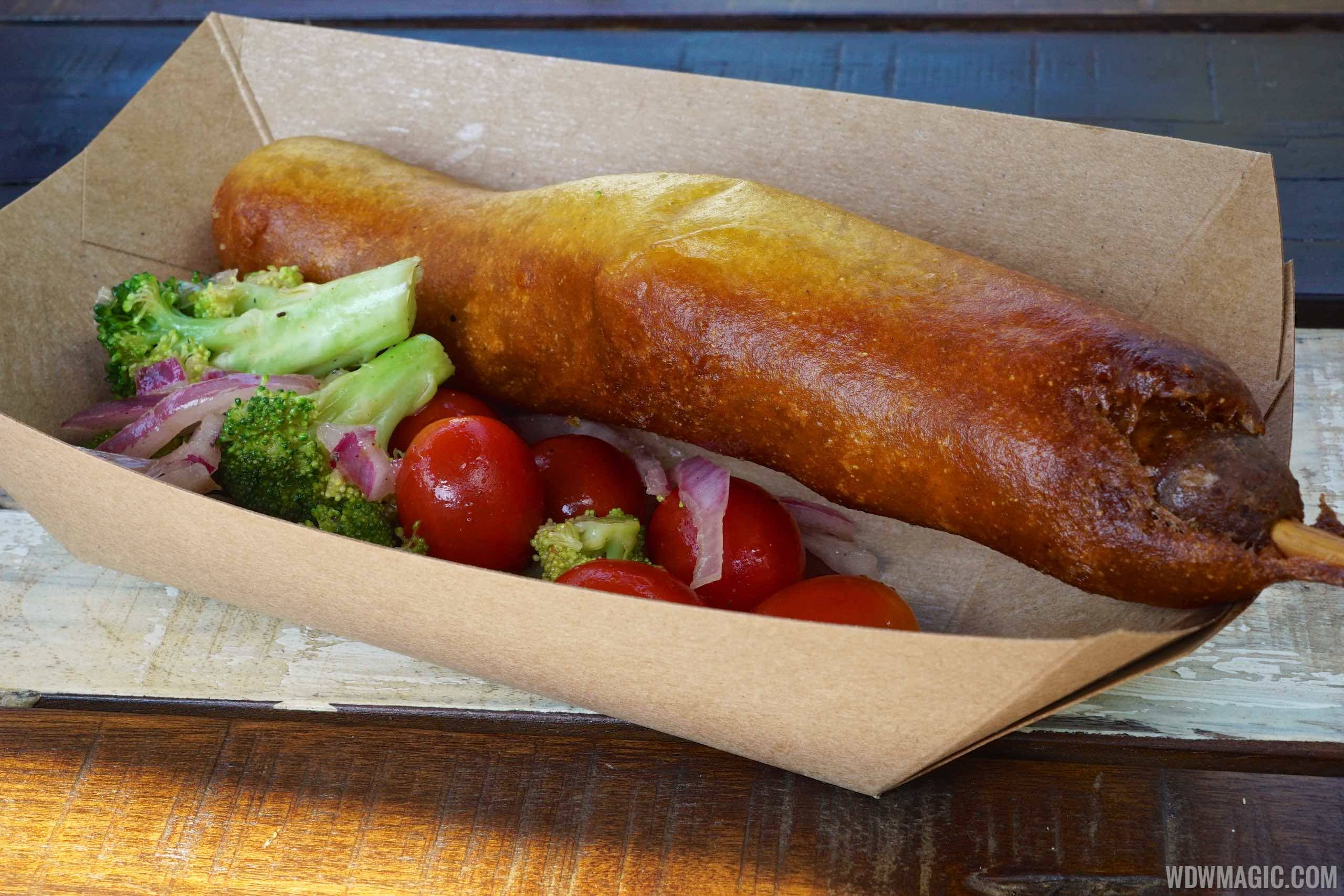 Harambe Market Food - Sausage fried in curried corn batter with roasted broccoli and tomato salad $8.99