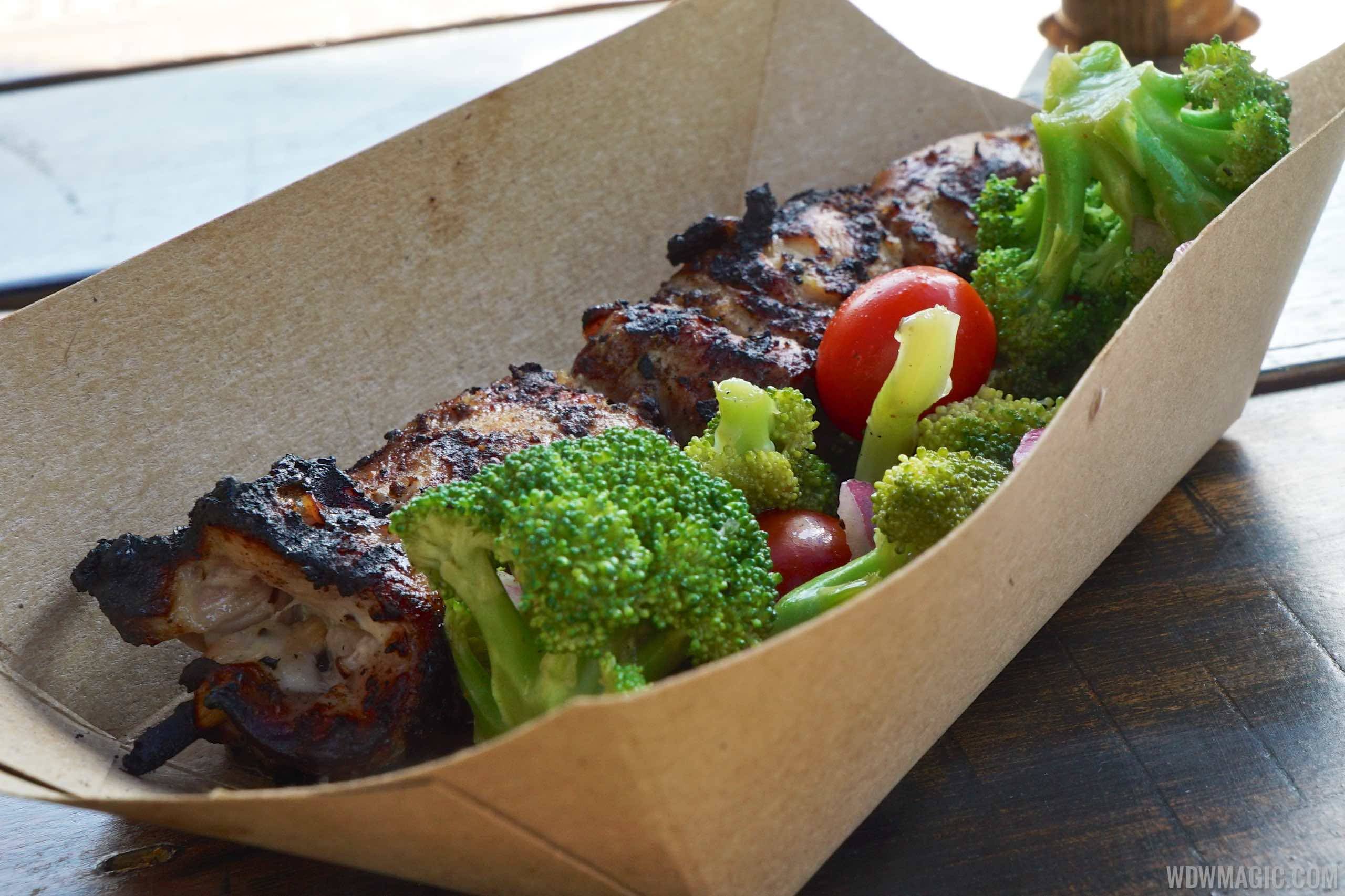 Harambe Market Food - Chicken Skewer with broccoli and tomato salad $8.99