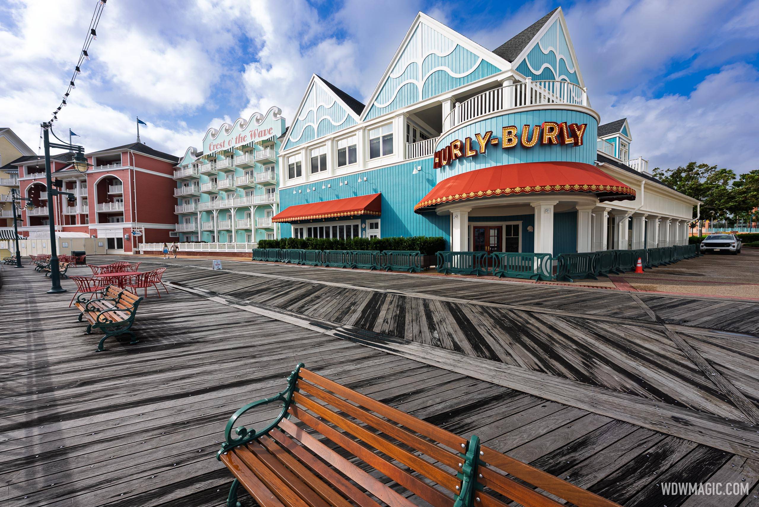 The Hurly-Burly marquee sign and teal wave-themed exterior are seen from the BoardWalk