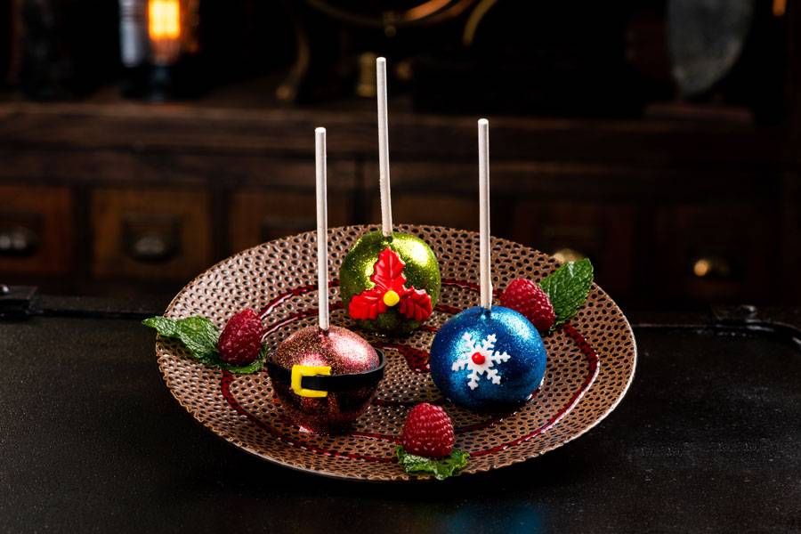 Jingle Bell Pops: Three dark chocolate truffles, crushed peppermint and peppermint syrup dipped in dark chocolate.