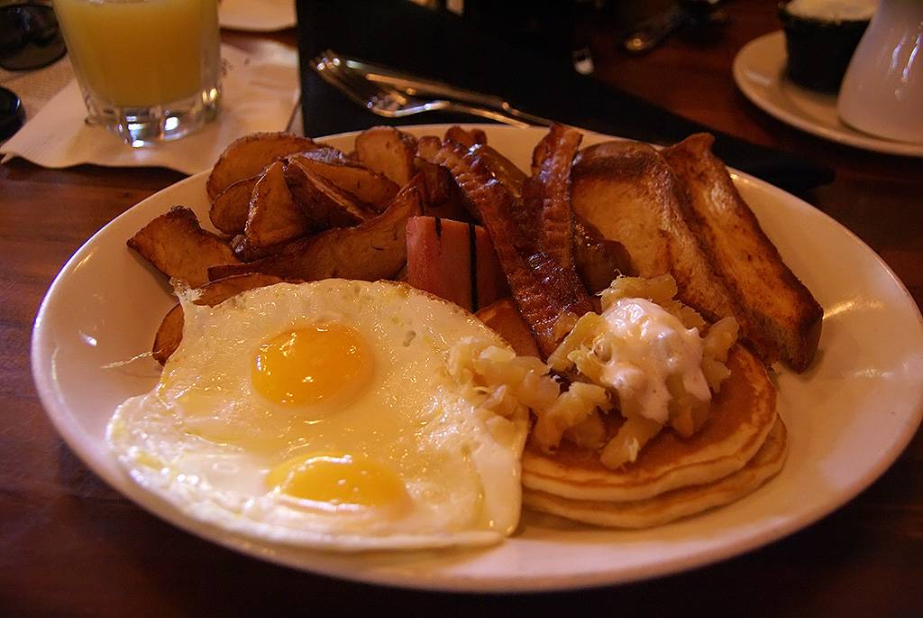 Big Kahuna - French Toast, Pancakes with Pineapple Sauce and Macadamia Nut Butter, Eggs, Home-fried Potatoes, Ham, Bacon, and Sausage