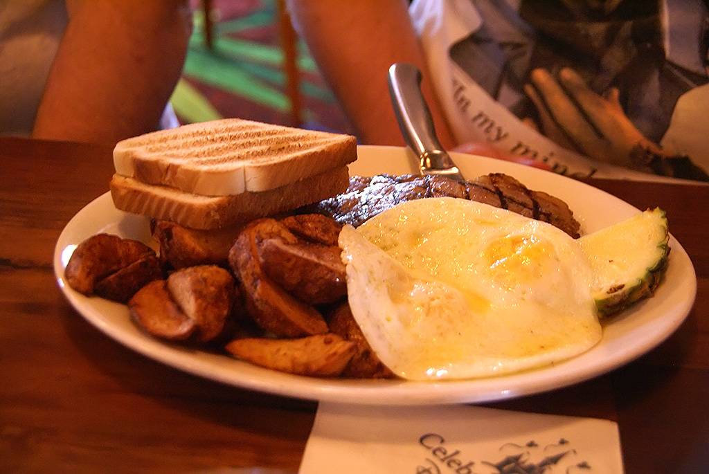 Steak and Eggs - New York Strip Steak served with two eggs, Home-Fried Potatoes, and a biscuit or toast