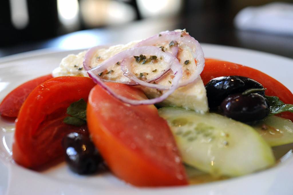 SPIRO’S GREEK SALAD: The traditional starter at Kouzzina by Cat Cora at Disney’s BoardWalk Resort includes tomatoes, cucumbers, red onions, kalamata olives and feta. Copyright 2009 The Walt Disney Co.