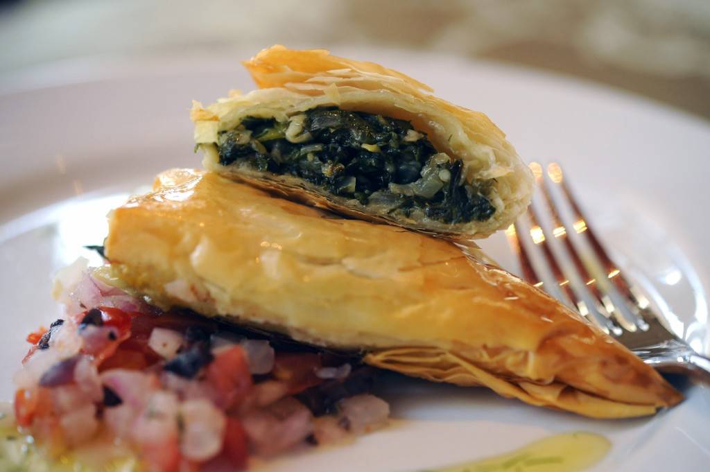 SPANAKOPITA: The version of this savory pie at Kouzzina by Cora at Disney’s BoardWalk Resort has a flaky phyllo crust and a filling of spinach, feta, leeks and dill. Copyright 2009 The Walt Disney Co.