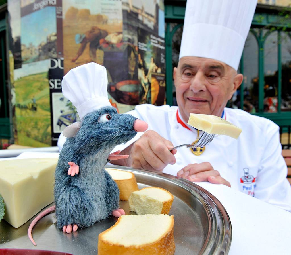 Famed French Chef Paul Bocuse greets a new Audio-Animatronics figure named "Remy" at Les Chefs de France restaurant at Epcot. Copyright 2009 The Walt Disney Company. 