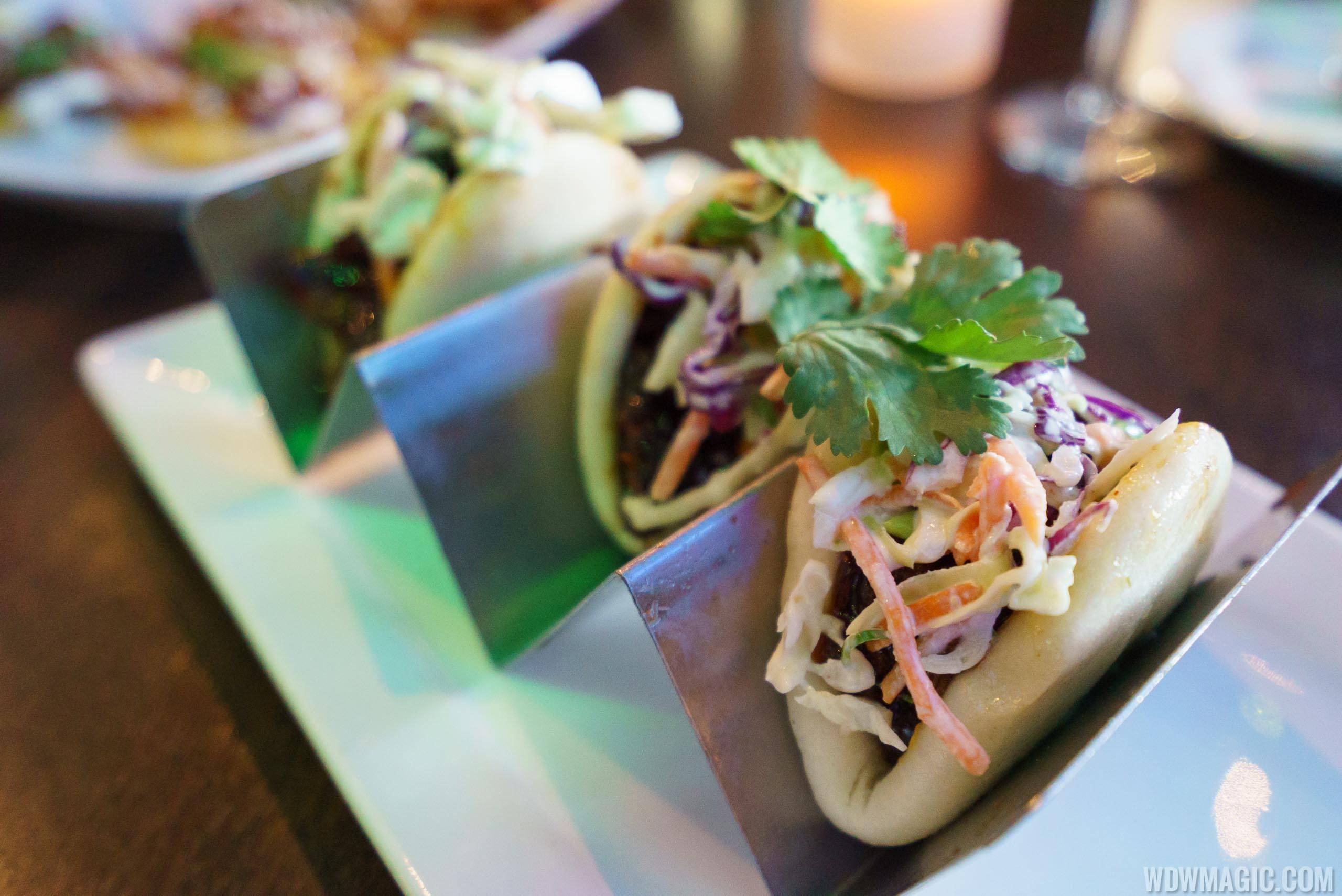 Chinese BBQ Pork - $13.99 Soft, steamed buns filled with Chinese BBQ pork, slaw and spicy Sriracha sauce