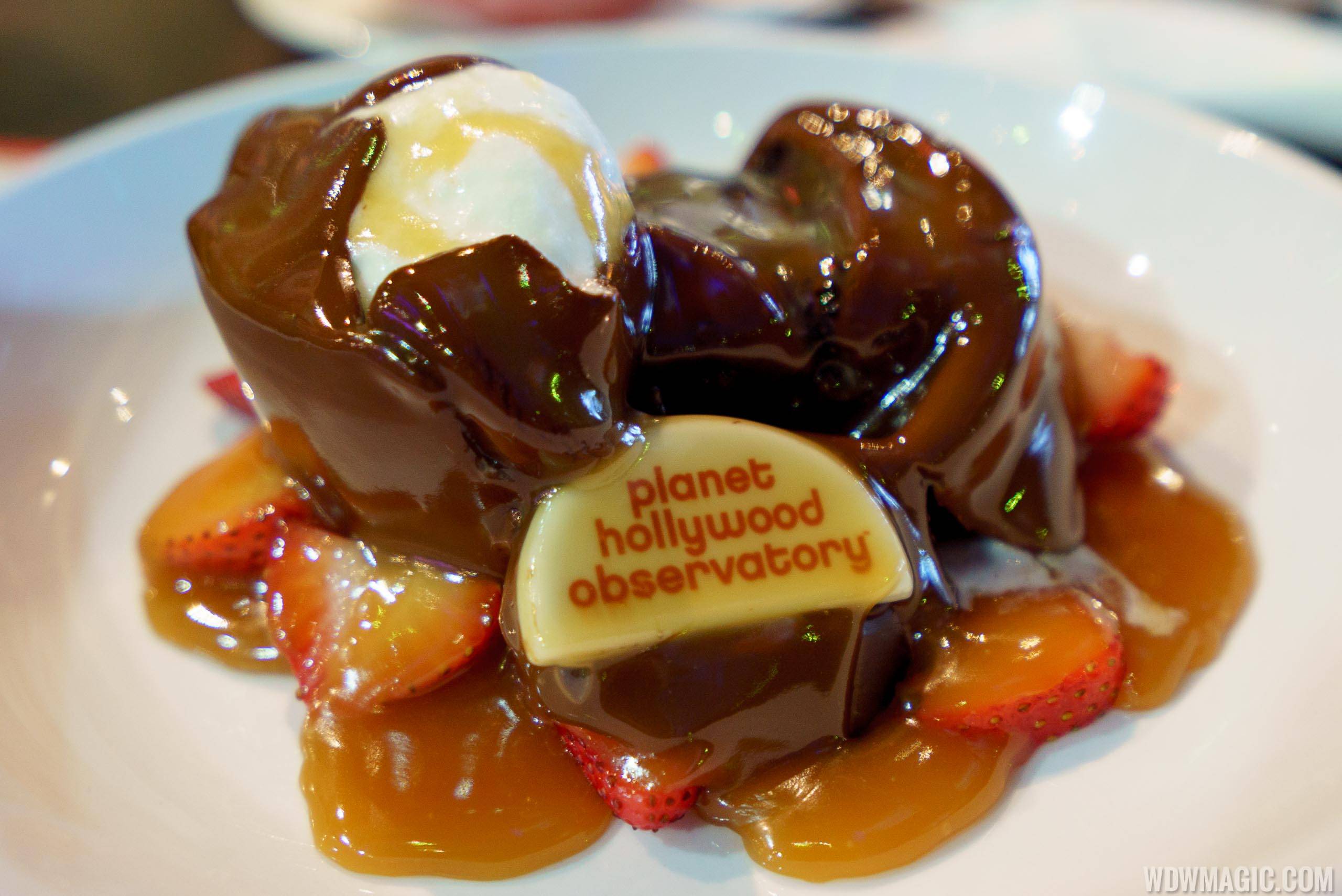 Planet Meltdown - $14.99 Chocolate sphere melted tableside by hot chocolate sauce to reveal double chocolate fudge cake, fresh strawberries and whipped cream 
