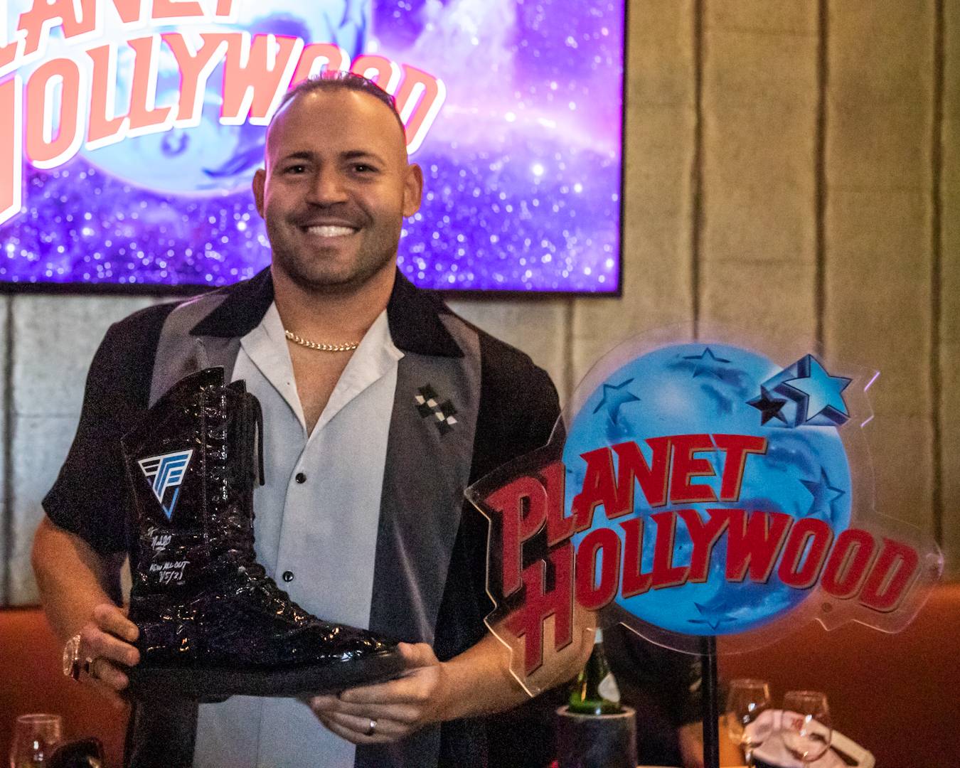 QT Marshall's Wrestling Boots Inducted into Planet Hollywood Disney Springs