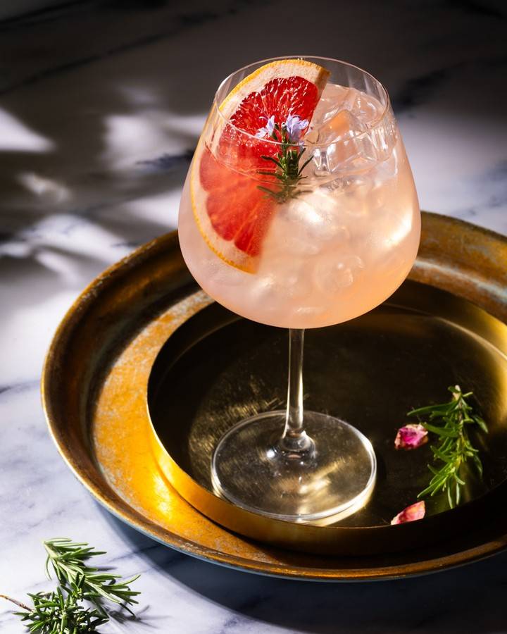 Wild Rosy: Glendalough Wild Rose Gin, Rockeys Botanical Liqueur, homemade rosemary syrup, lemon Pellegrino, Fever Tree premium tonic