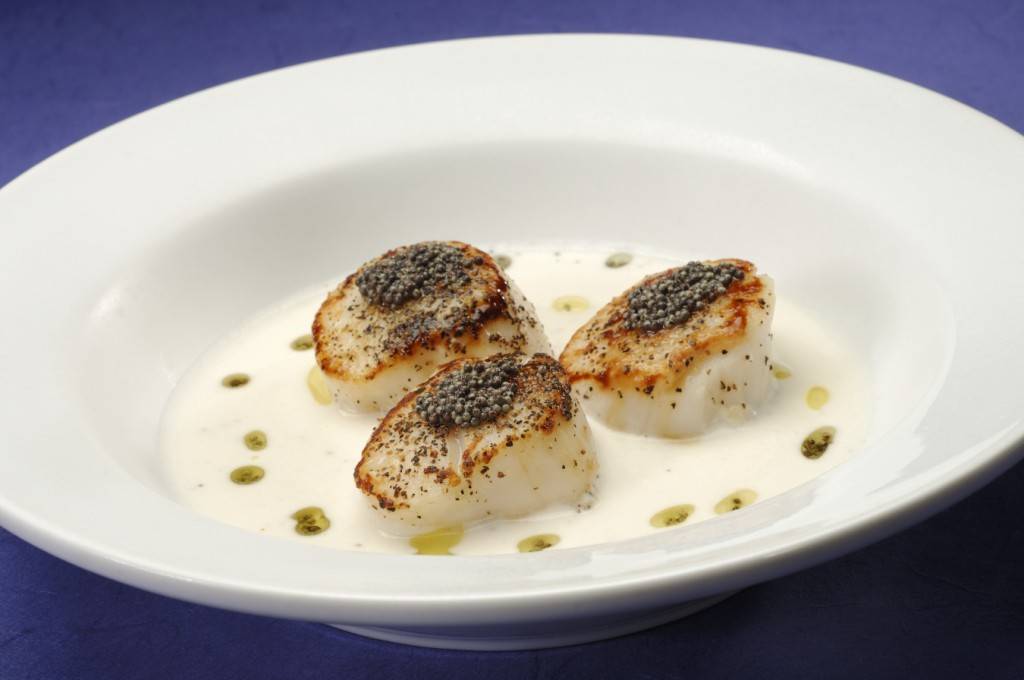 Mustard seed-crusted Scallops with a coconut cream suace.