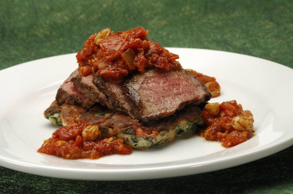 Grilled Flank Steak, with spinach and mushroom pancake served with oven-dried chutney.