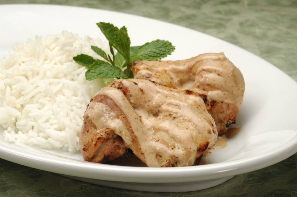 Tandoori Chicken served with basmati rice or seven-grain pilaf.