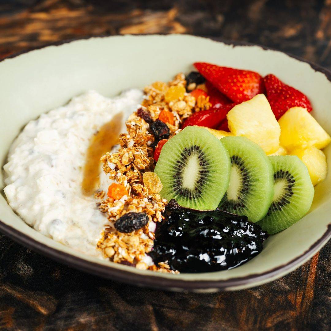 Tropical Pandoran Forest Fruits with fresh yogurt, muesli, and honey