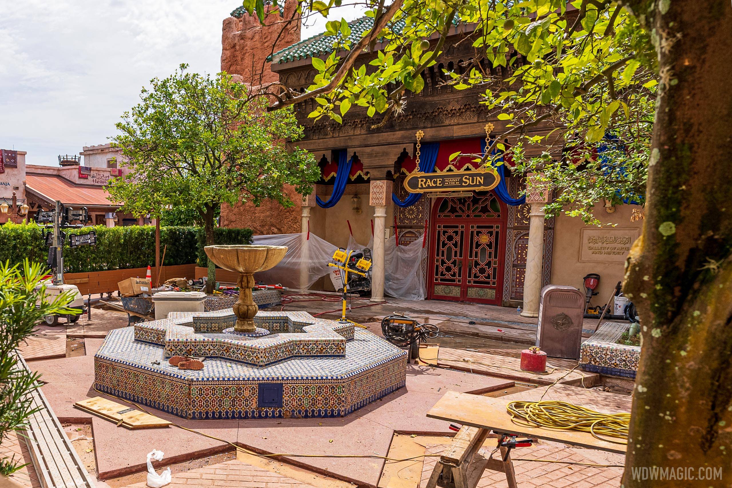 View of the new concrete work around the central fountain of the Morocco Pavilion