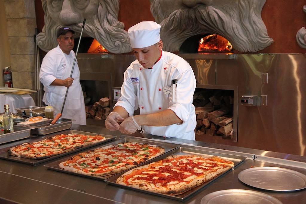 1/2 meter pizza being prepared