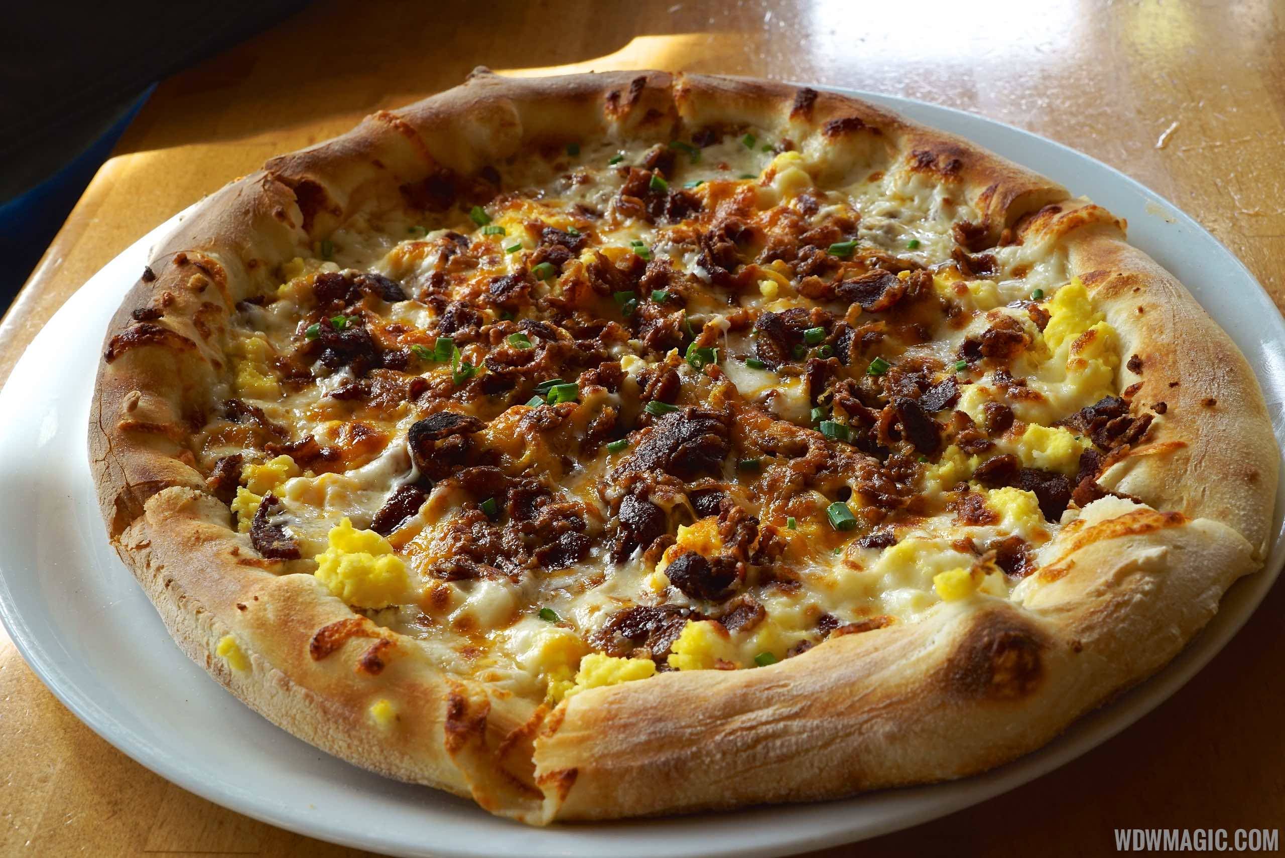 Wolfgang Puck Express Marketplace breakfast - Breakfast Pizza with Egg Whites Scrambled Egg Whites, Bacon, Mozzarella, Cheddar and Carmelized Onions $14.50