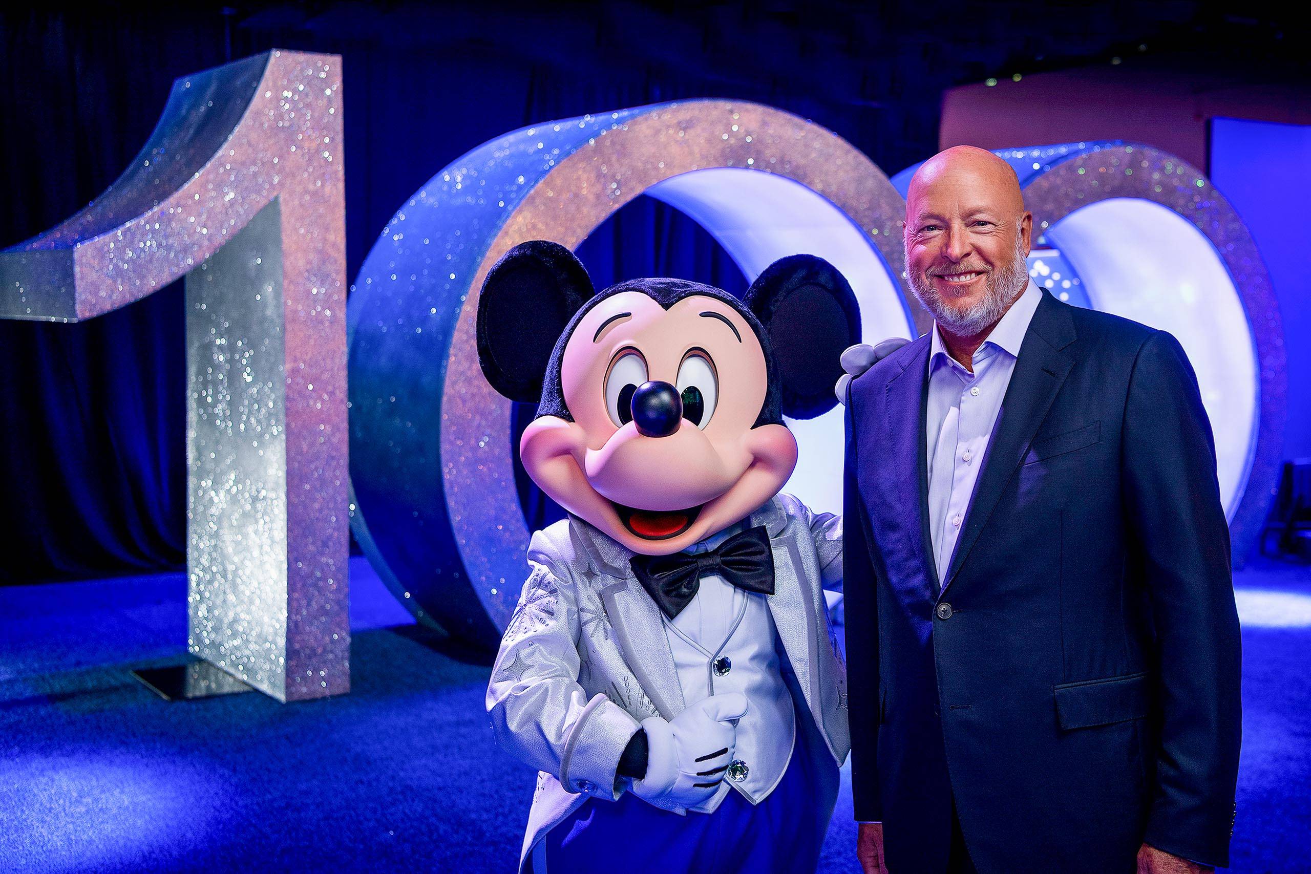 Disney CEO Bob Chapek and Mickey Mouse in his shimmering new "platinum" outfit