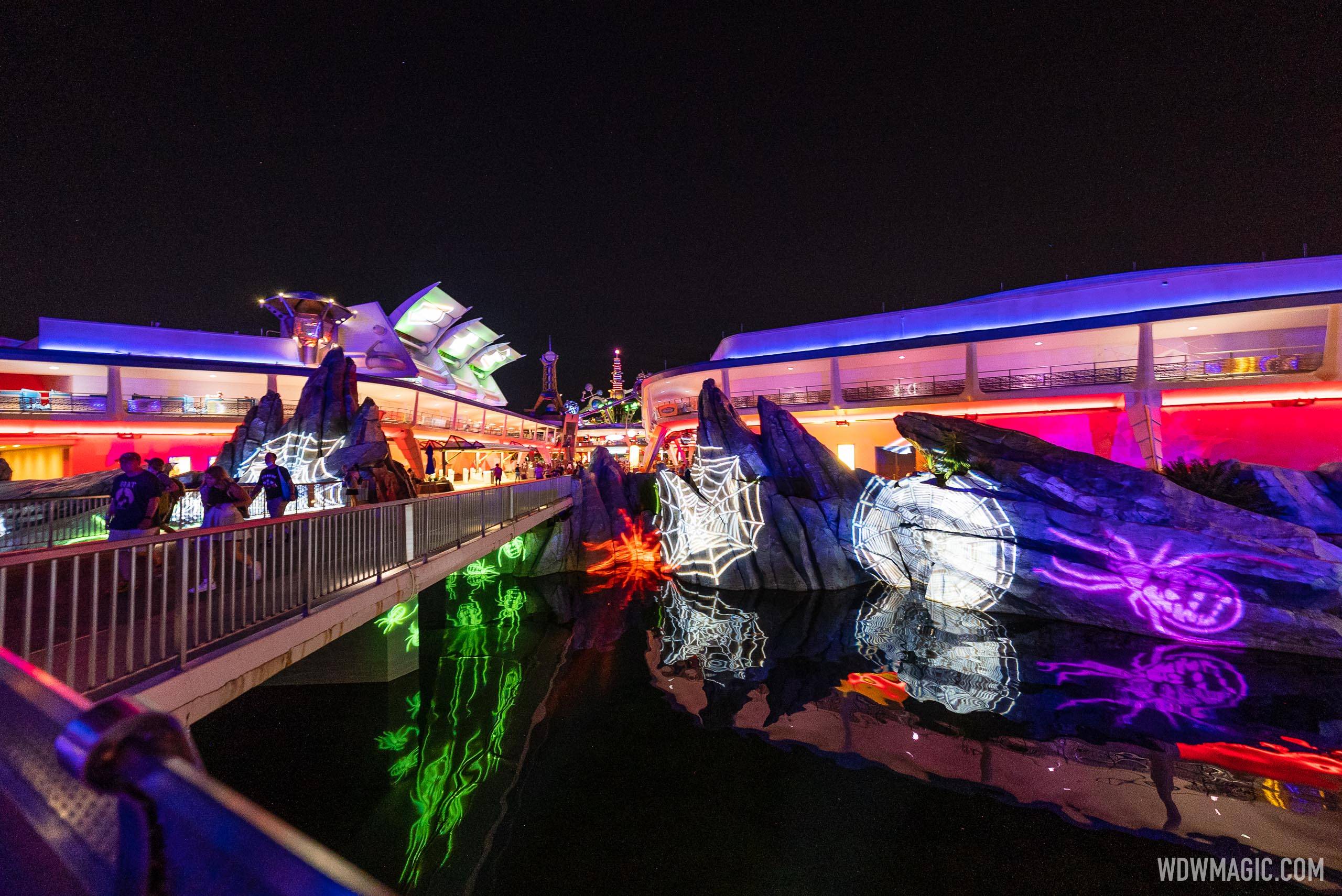 Halloween lighting effects at the entrance to Tomorrowland