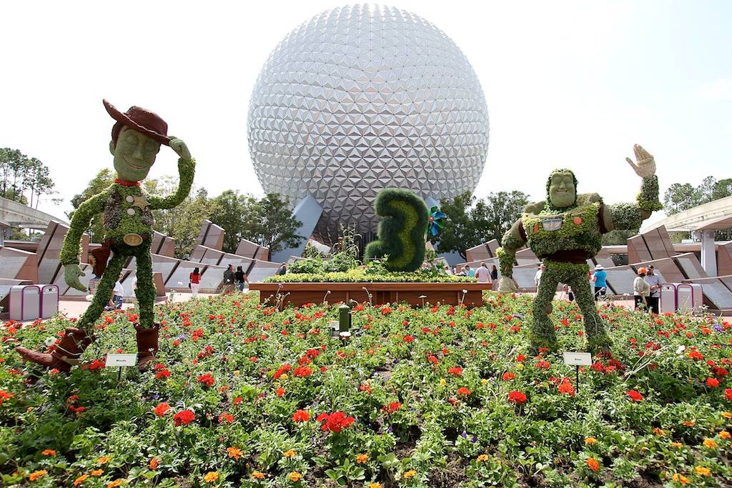 Buzz and Woody infront of Spaceship Earth welcome guests to this year's festival
