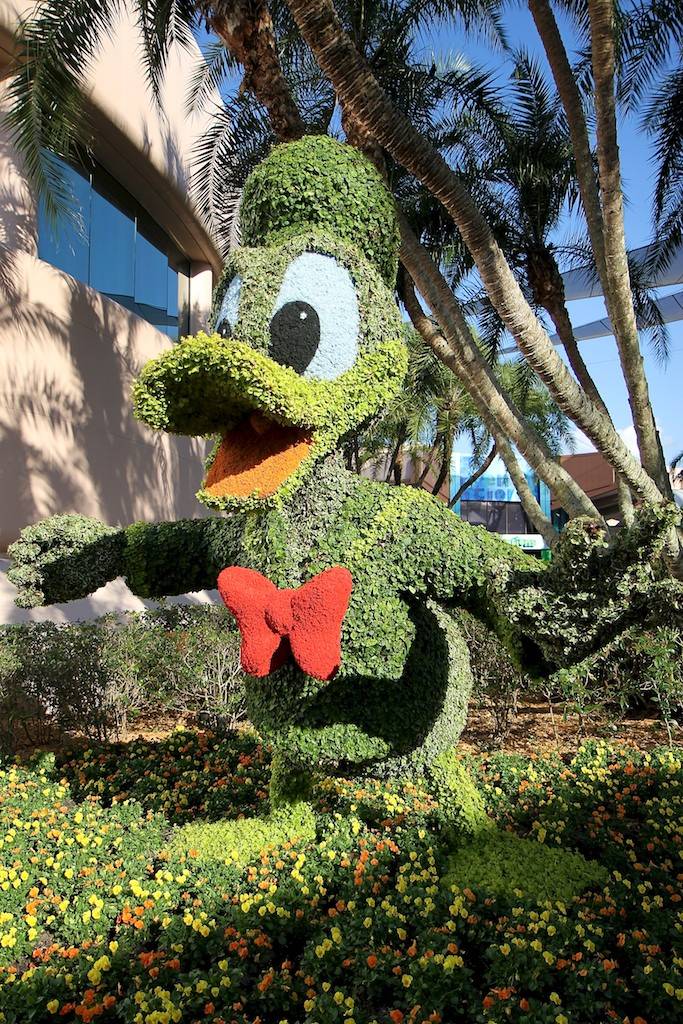 Donald Duck topiary behind Spaceship Earth