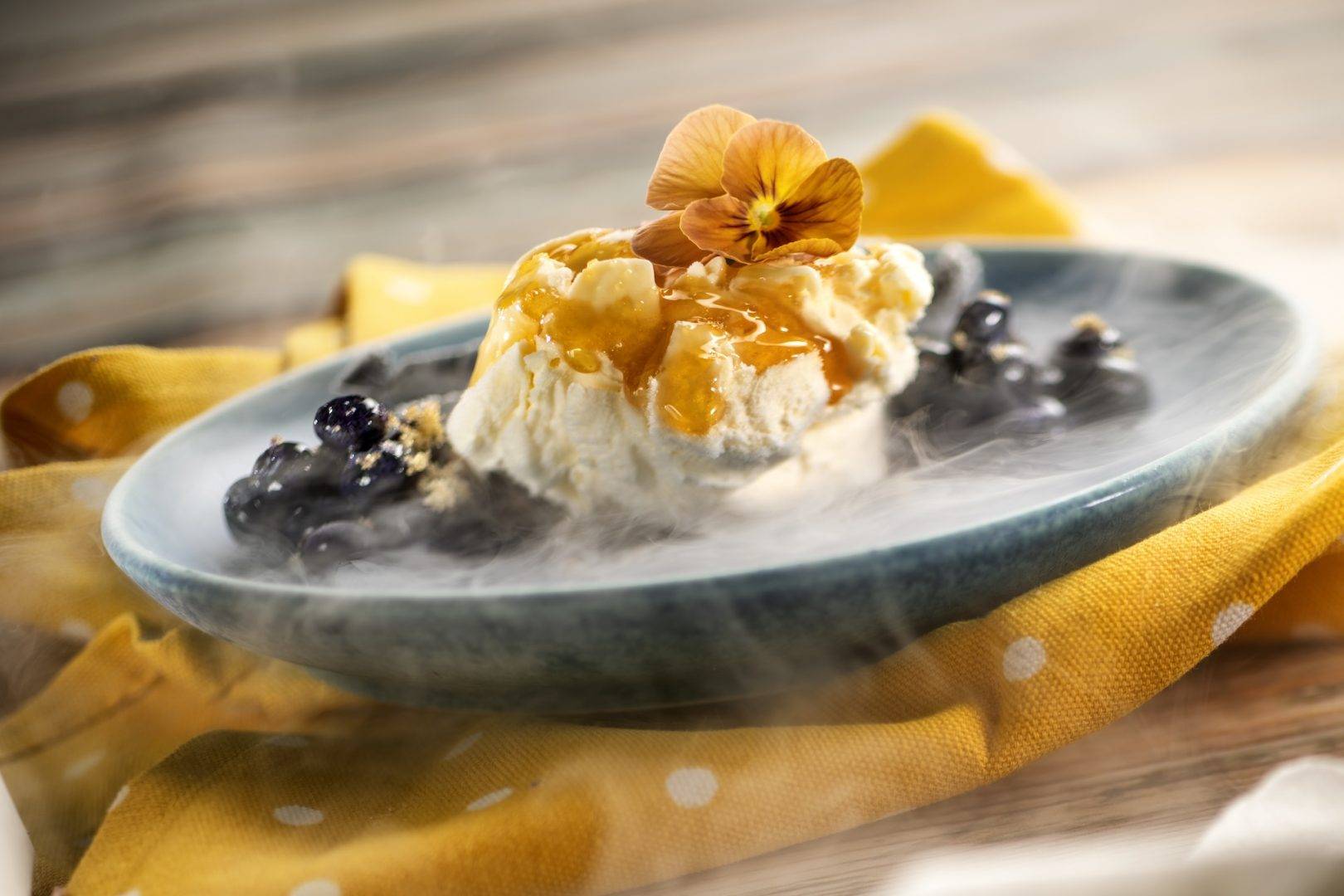 Liquid Nitrogen Honey-Mascarpone Cheesecake with fresh honey, granulated honey, and honey mead-blueberry compote