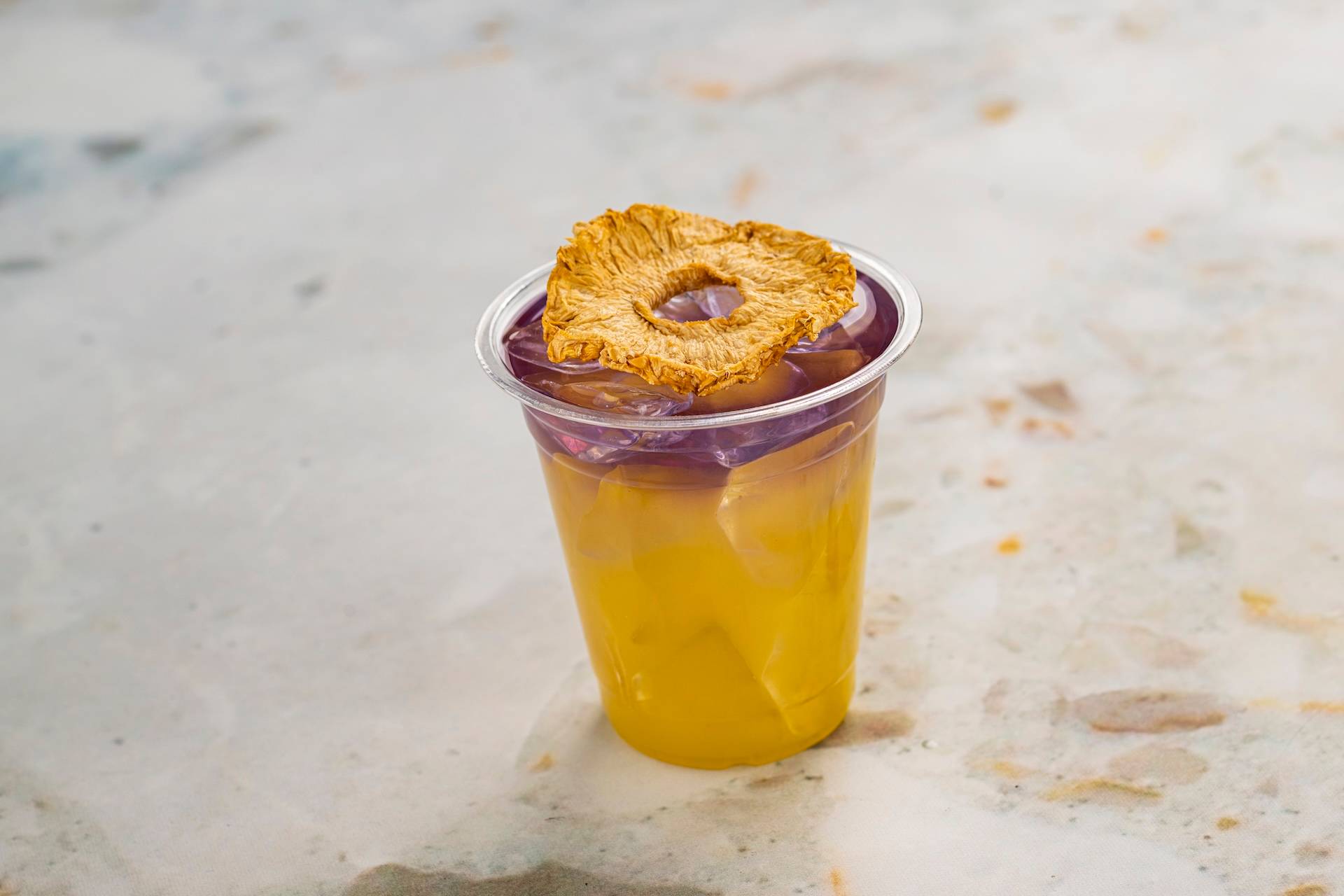 Garden Glimmer: Empress 1908 Gin, DOLE Pineapple Juice, lemon juice, and almond-flavored syrup (New)