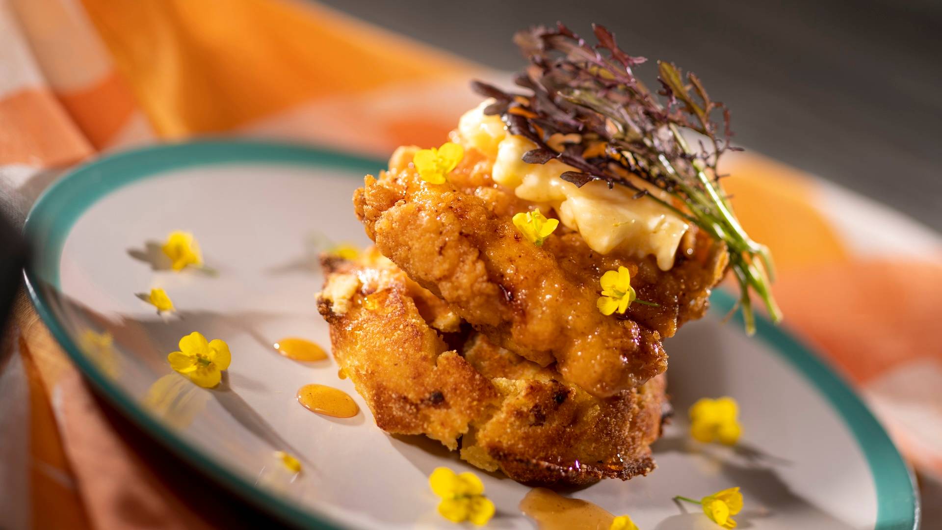 Chicken and Waffles: Crispy chicken and a sweet honey-bacon cornbread waffle with whipped honey butter and orange blossom honey