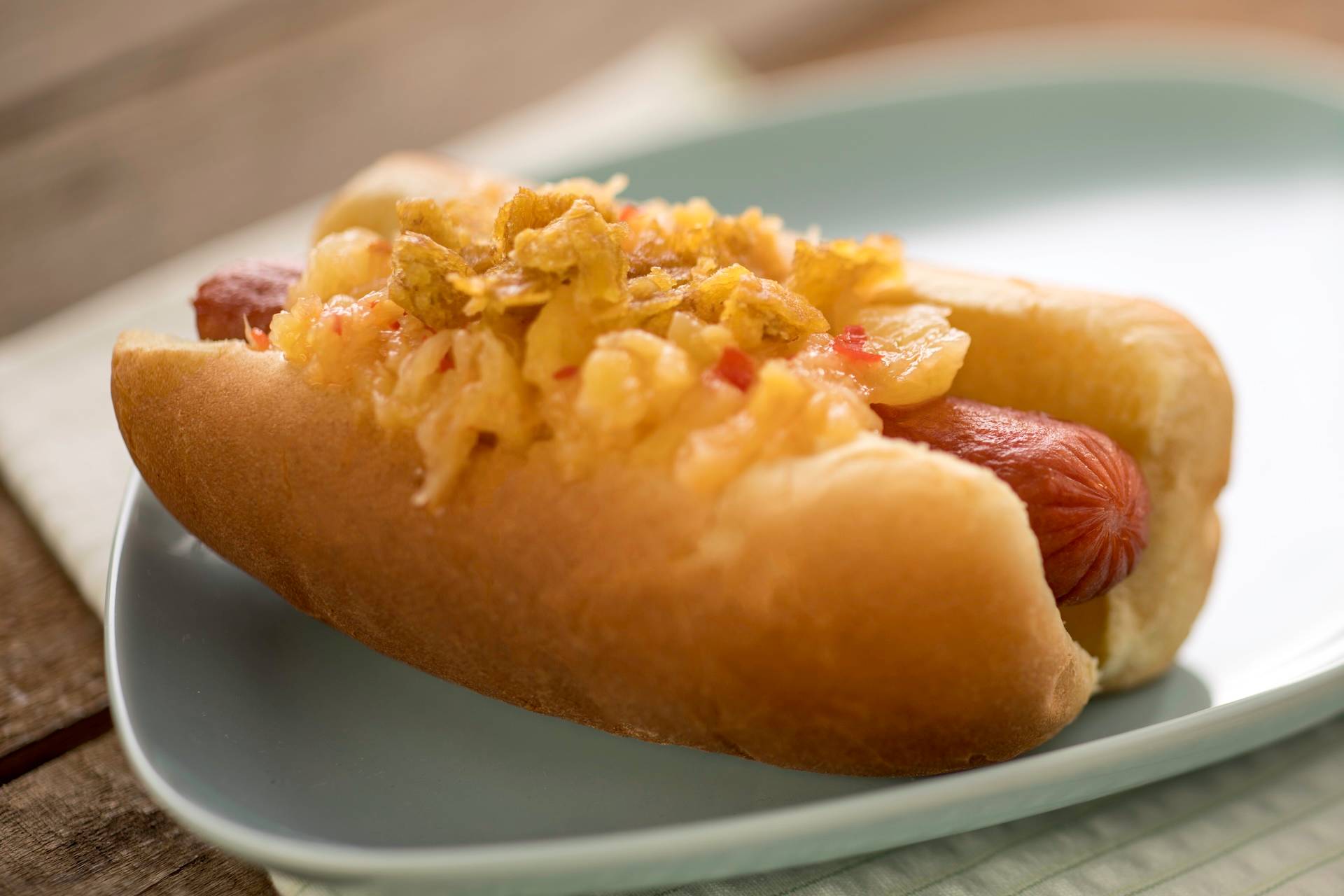 Spicy Hot Dog with pineapple chutney and plantain chips