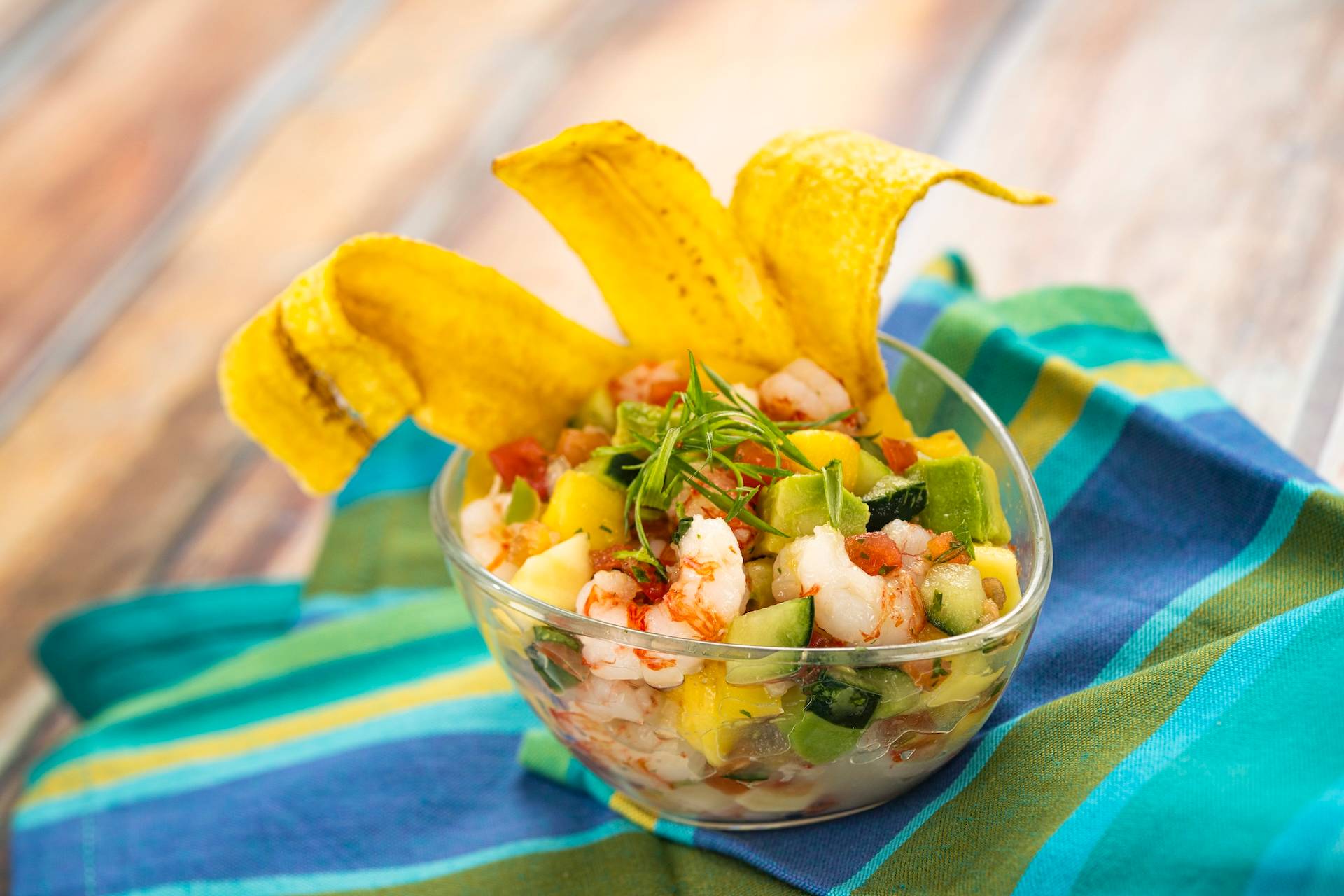 Ceviche: Shrimp with mango, avocado, cucumber, lime, cilantro, tomato, and jalapeno served with plantain chips (New)