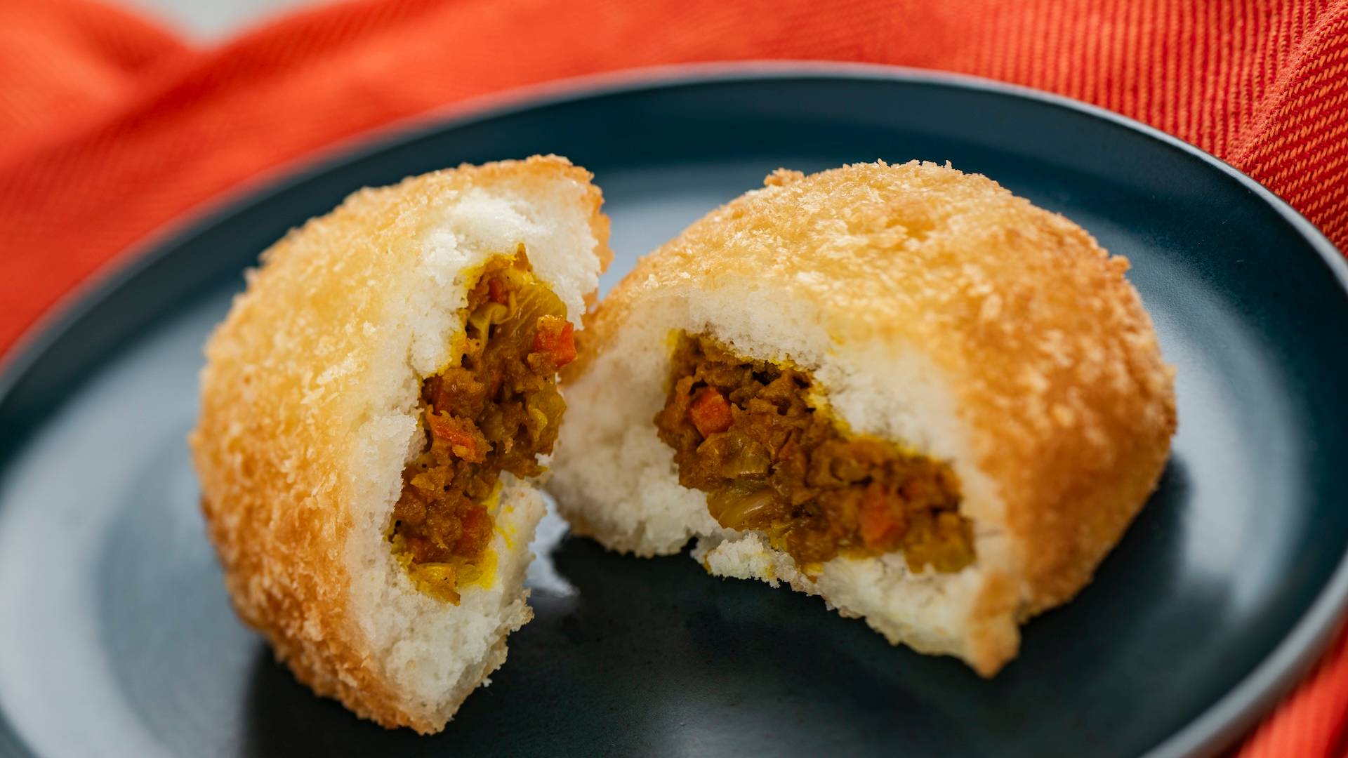 Japanese Curry Bread: Golden, crispy fried bread filled with a fragrant Japanese vegetable curry (New)