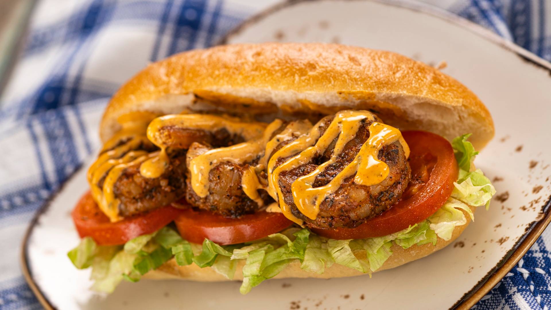 Blackened Shrimp Po' Boy with lettuce, tomato, and Cajun remoulade (New)