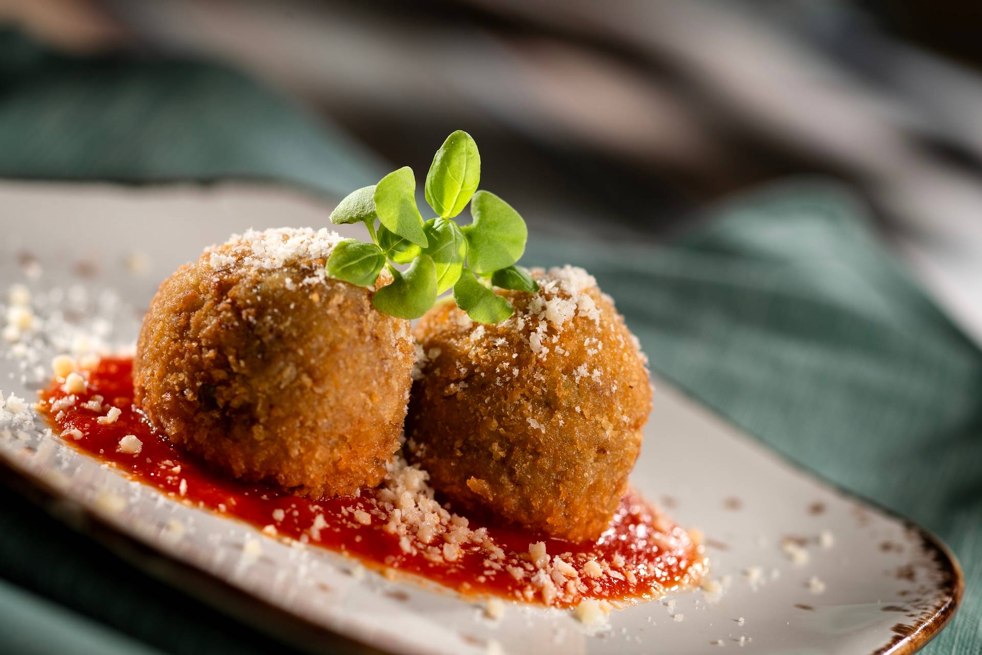 Arancini: Risotto, beef ragout, peas, parmesan, and tomato sauce (New)