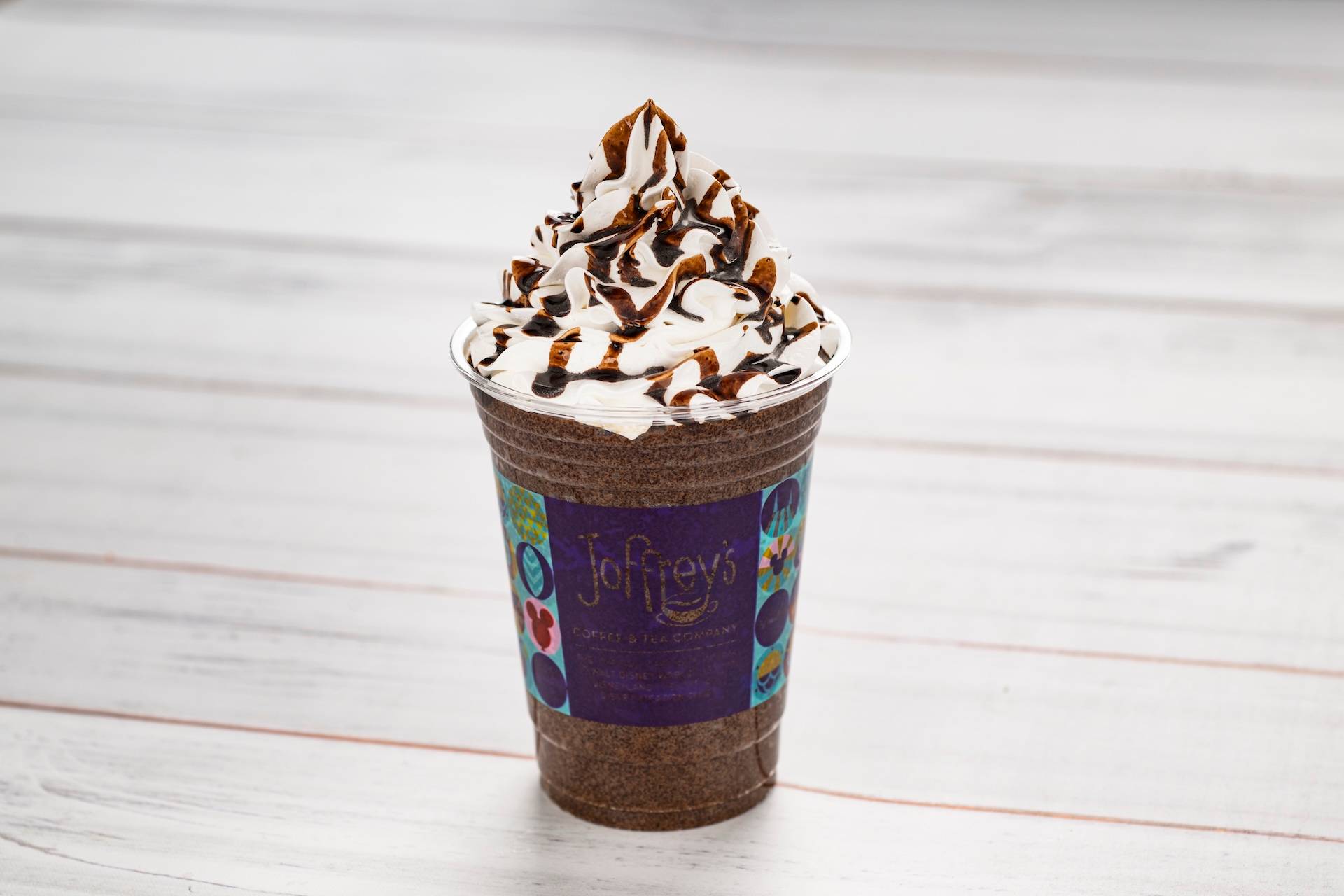 Dubai Chocolate Frozen Cappuccino: Frozen cappuccino featuring Joffrey&rsquo;s Coffee with pistachio syrup topped with whipped cream and dark chocolate sauce (Non-alcoholic) (New) (Spirited version available with Kahl&uacute;a Coffee Liqueur)