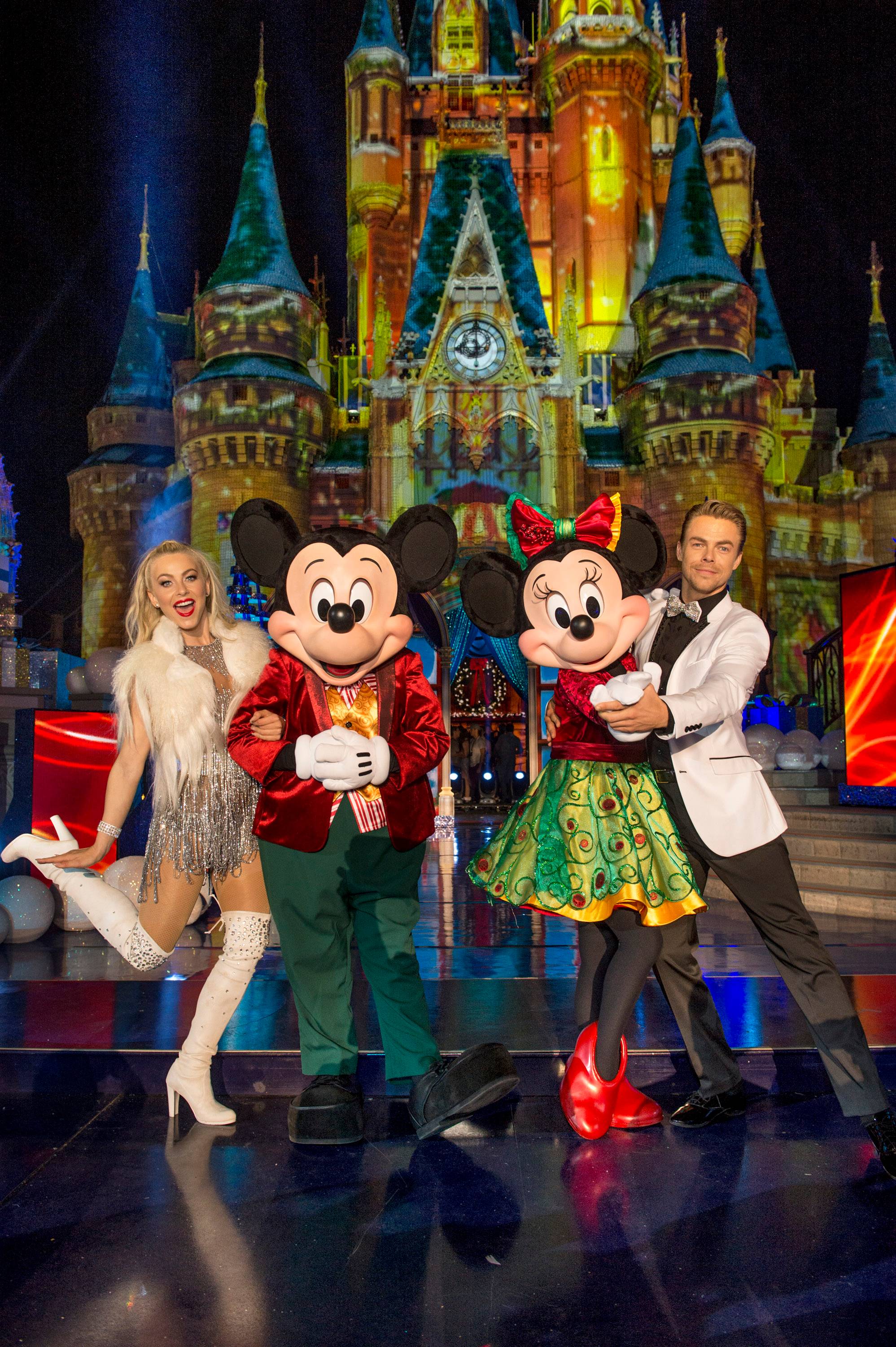 Julianne Hough and pro-dancer Derek Hough pose with Mickey Mouse and Minnie Mouse