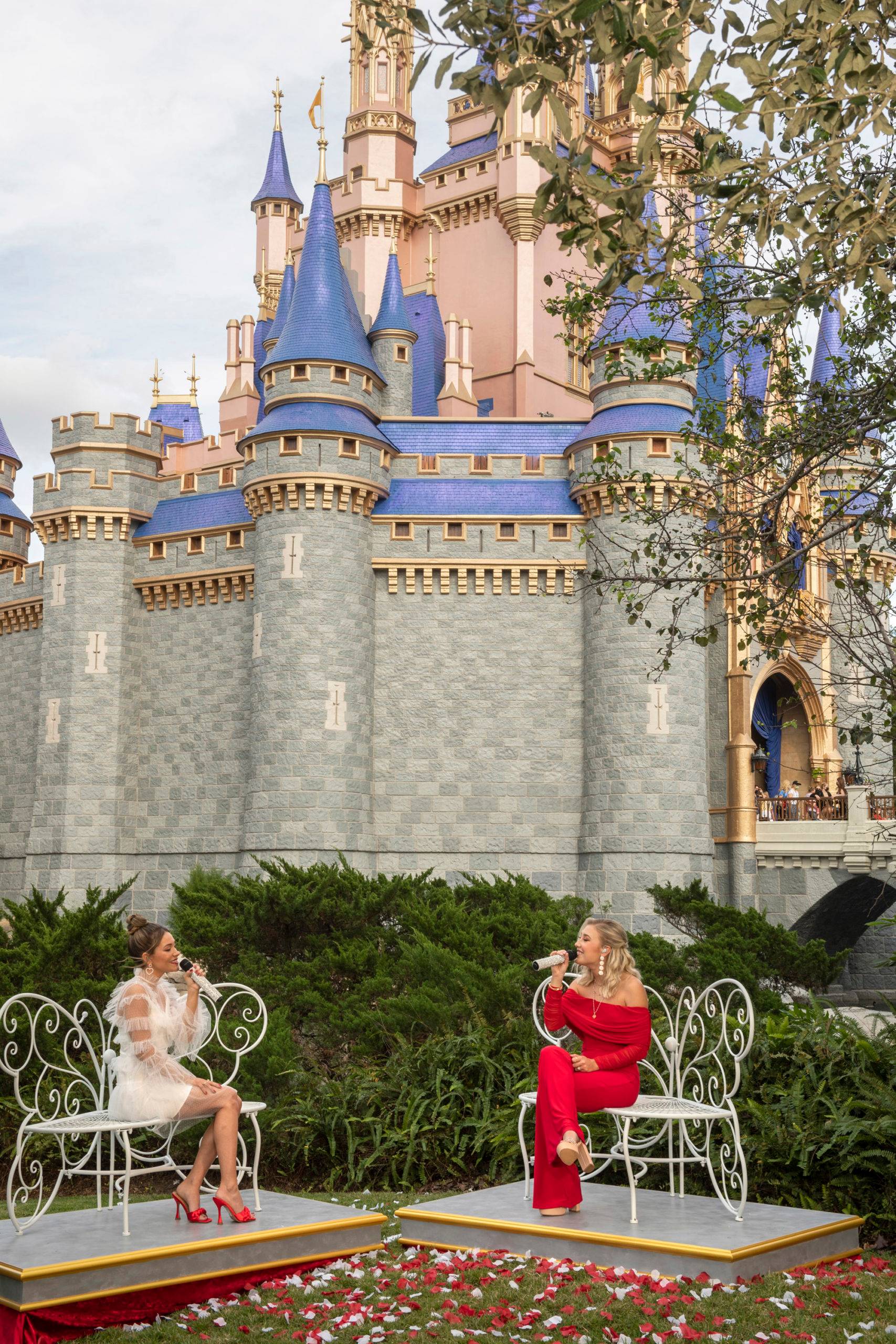 Country duo Maddie & Tae perform in front of Cinderella Castle at Magic Kingdom